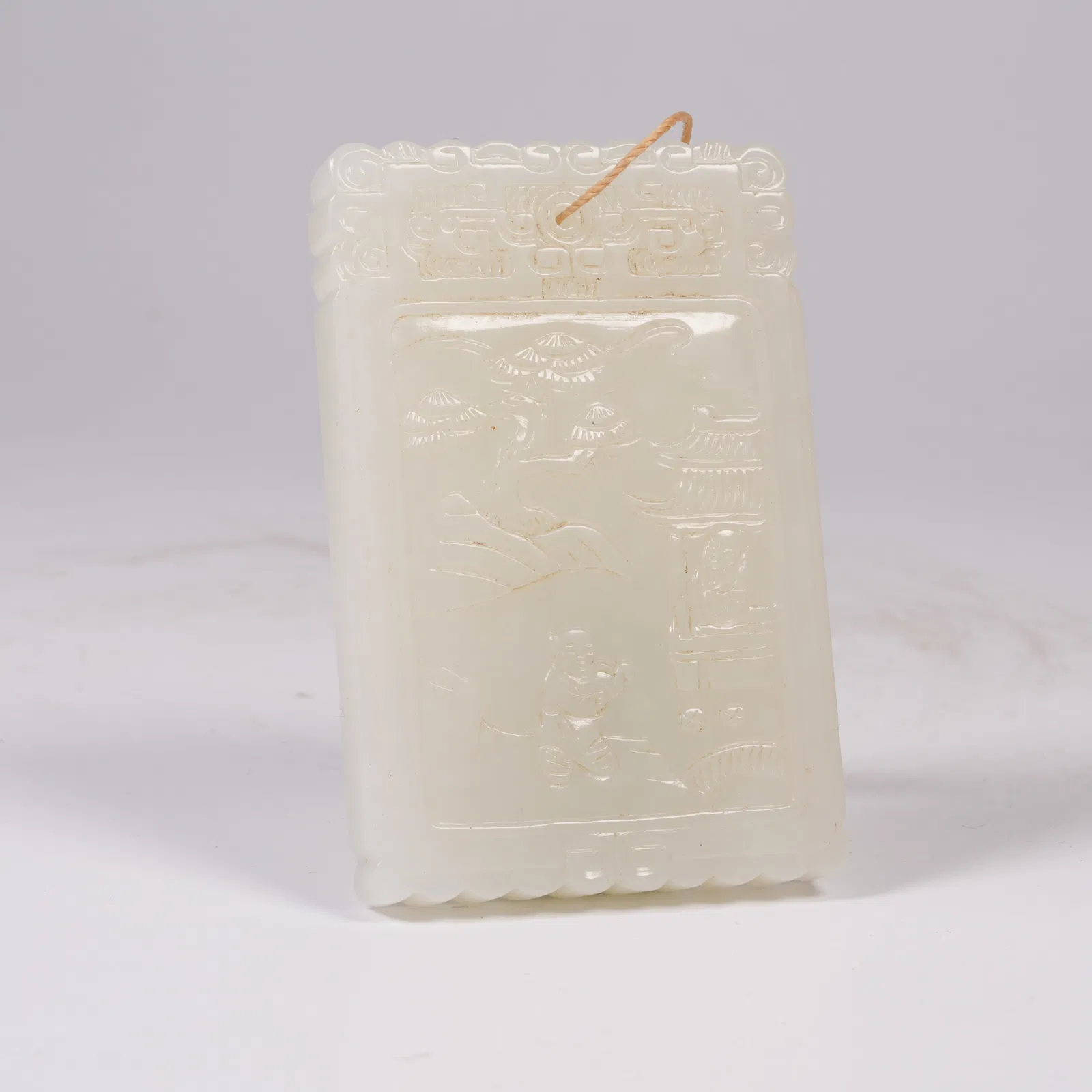 A HETIAN WHITE JADE PLAQUE WITH PAVILION AND FIGURE MOTIF