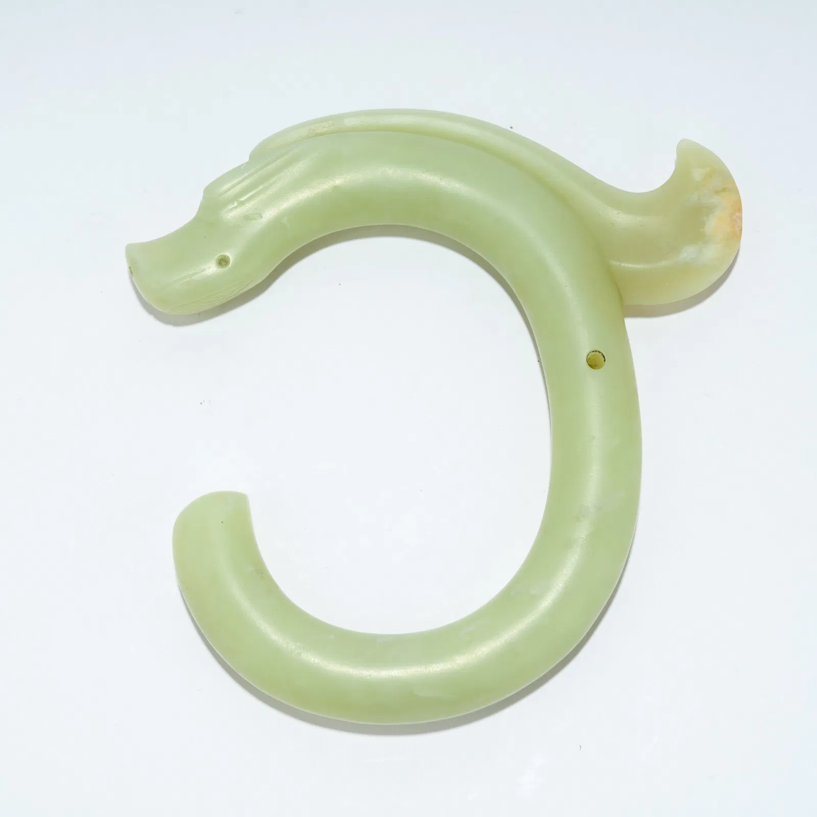 A HONGSHAN CULTURE JADE CARVING OF A C-SHAPED DRAGON