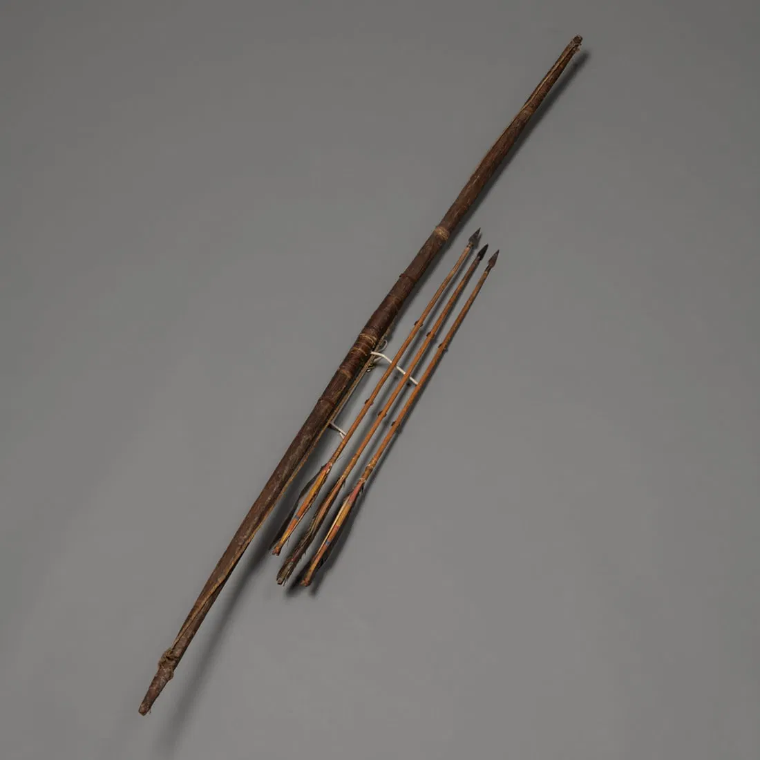 A Hopi sinew-backed bow with three arrows