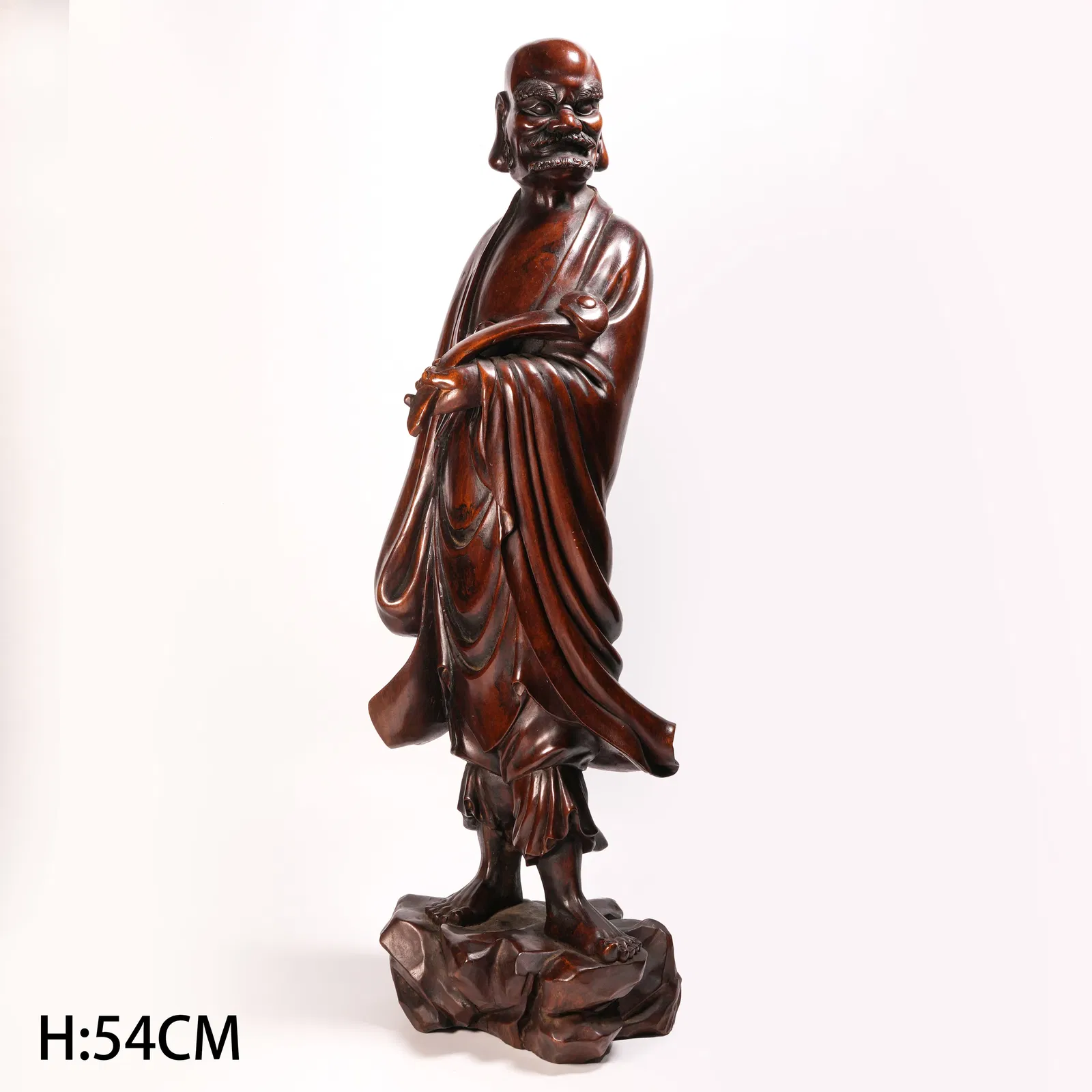 A HUANGHUALI ARHAT FIGURINE