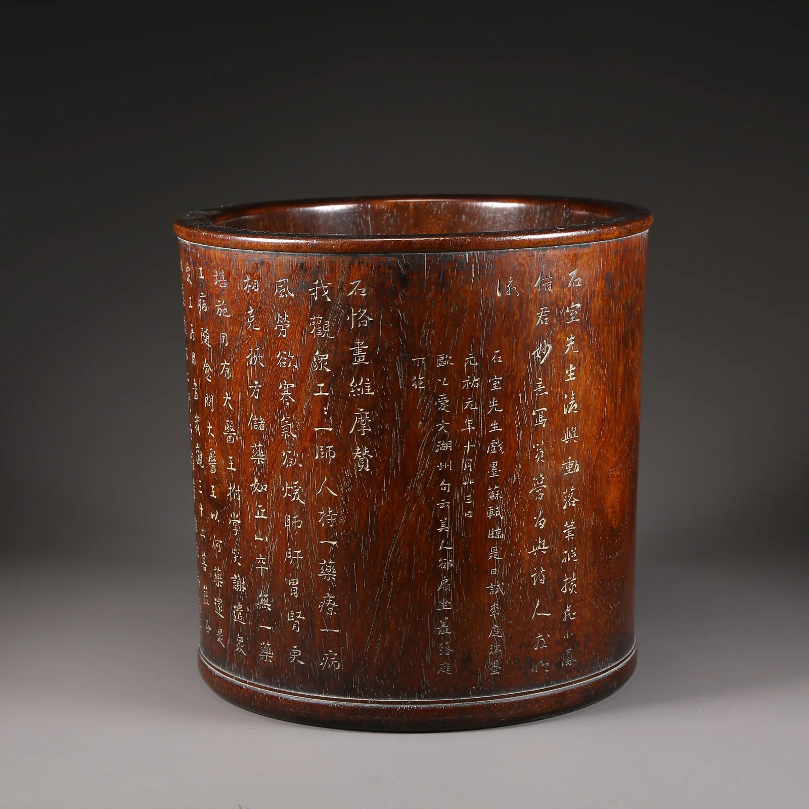 A HUANGHUALI BRUSH POT CARVED WITH POETIC INSCRIPTIONS