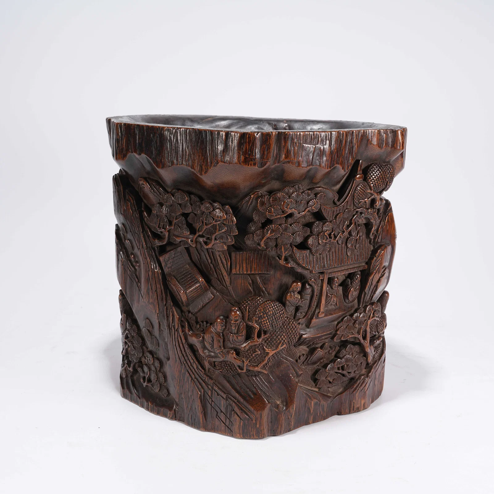 A HUANGHUALI BRUSH POT WITH "ELEGANT GATHERING UNDER PINES" MOTIF
