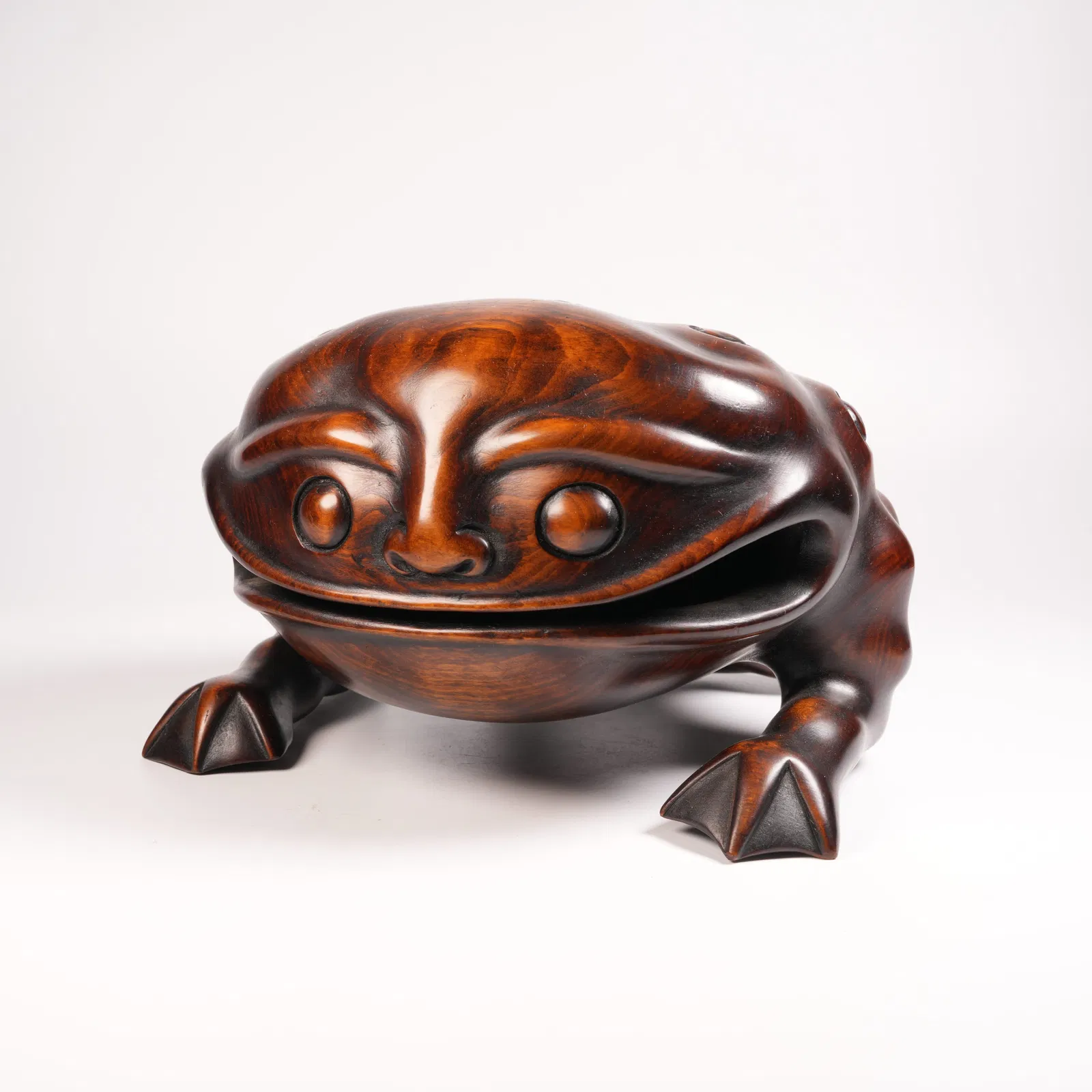 A HUANGHUALI GOLDEN TOAD FIGURINE