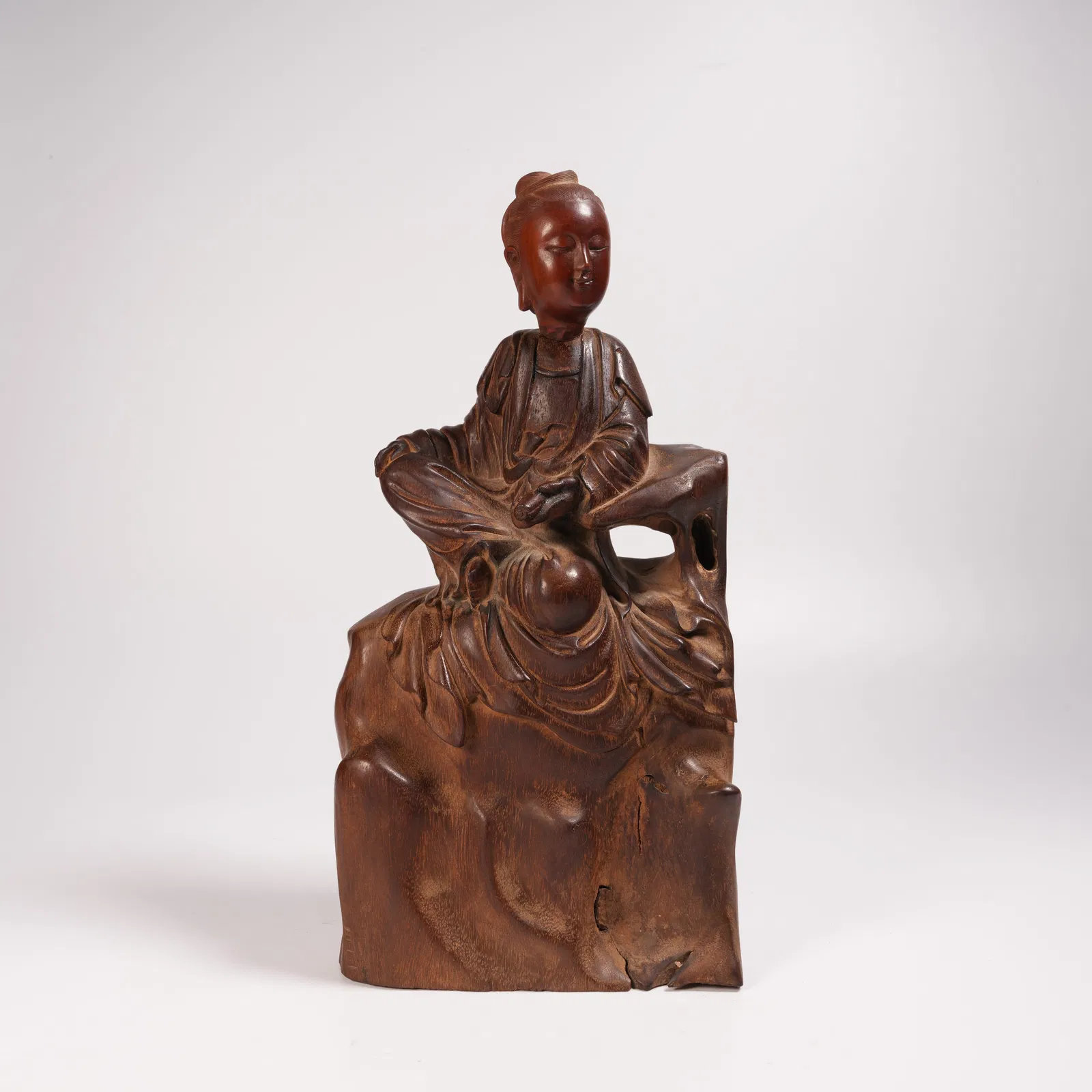 A HUANGHUALI GUANYIN HOLDING A SCROLL STATUE