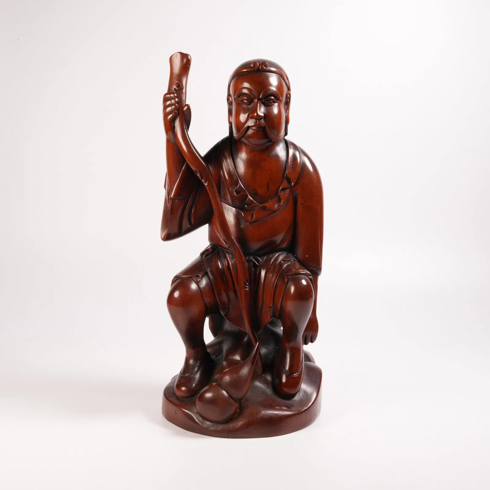 A HUANGHUALI IRON-CRUTCH LI FIGURINE
