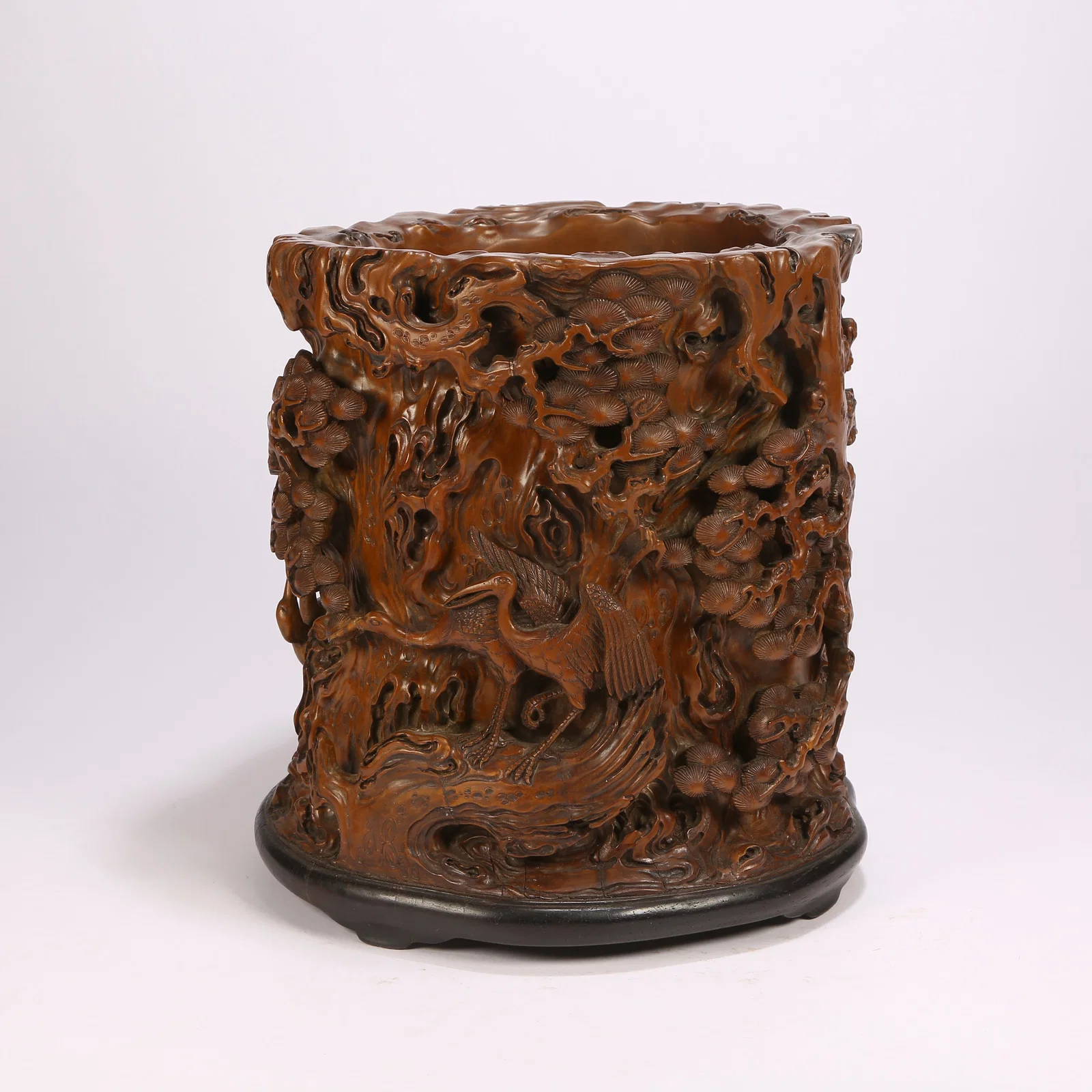 A HUANGHUALI WOOD BRUSH HOLDER WITH PINE-AND-CRANE "LONGEVITY" MOTIF