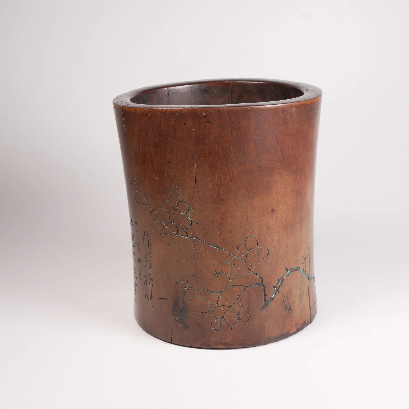 A HUANGHUALI WOOD BRUSH POT WITH FLORAL MOTIF