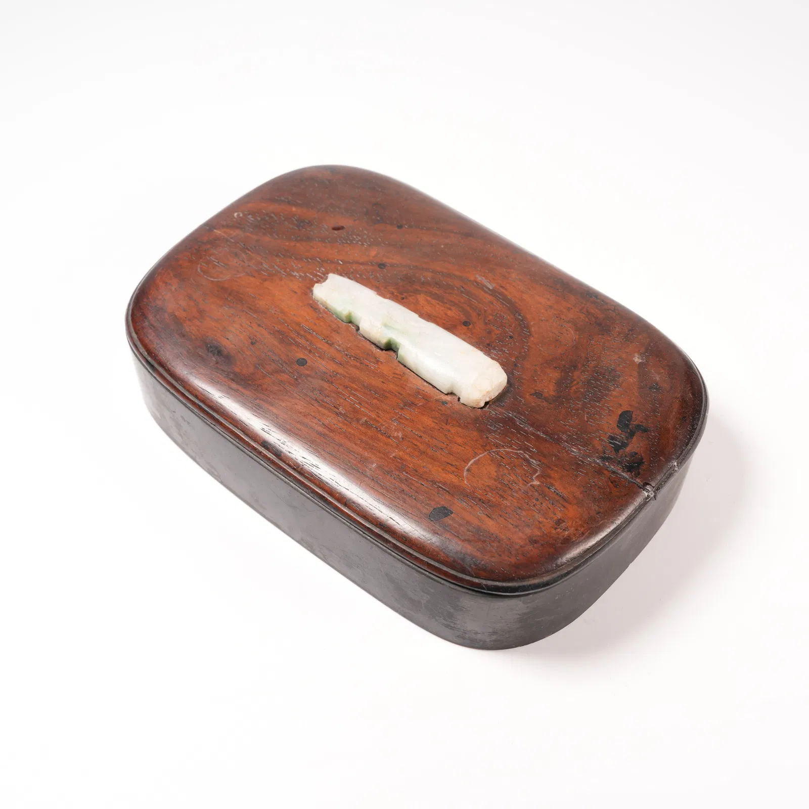 A HUANGHUALI WOOD INKSTONE WITH INLAID JADE AND QIN MOTIF