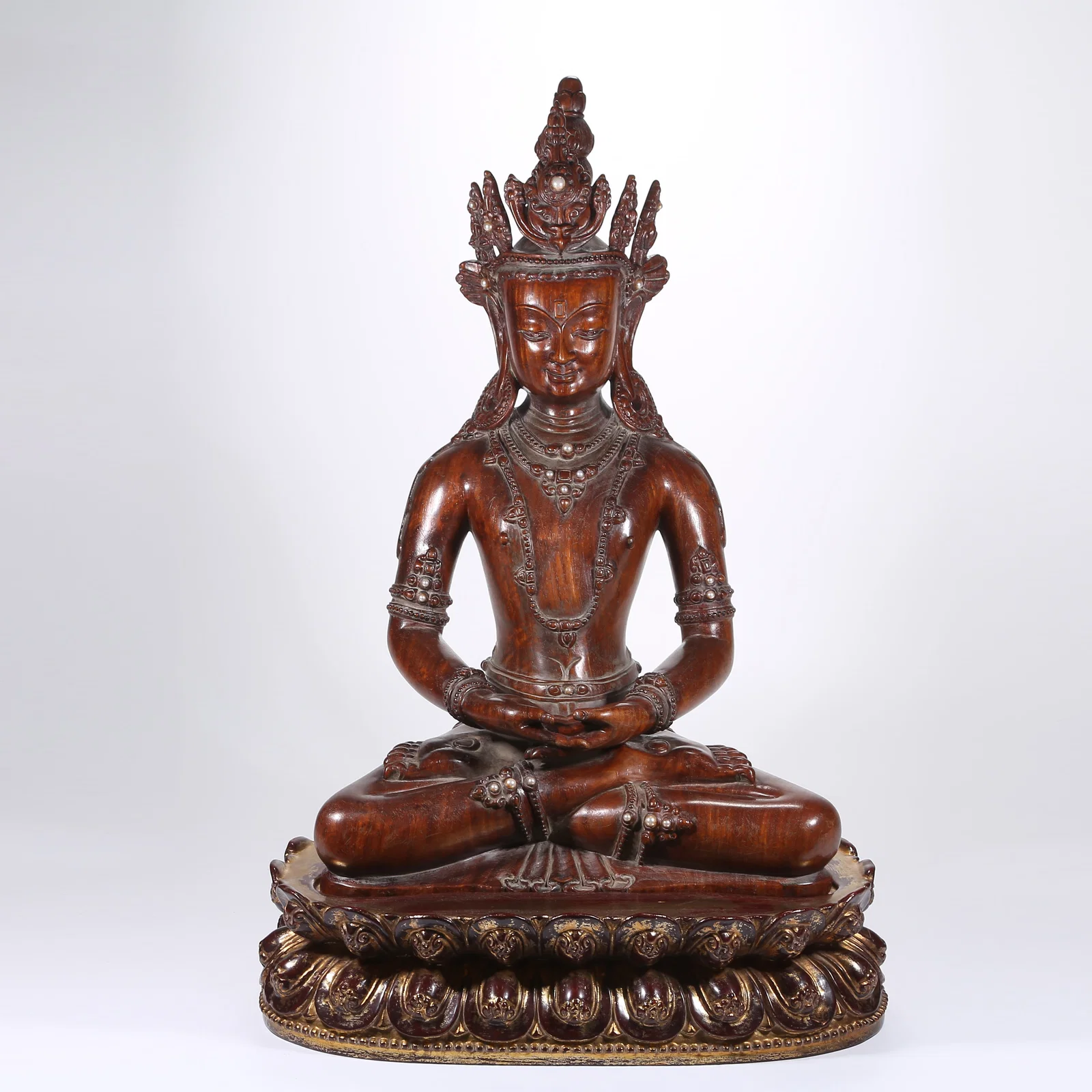 A HUANGHUALI WOOD INLAID WITH EASTERN PEARLS, AMITAYUS BUDDHA FIGURE