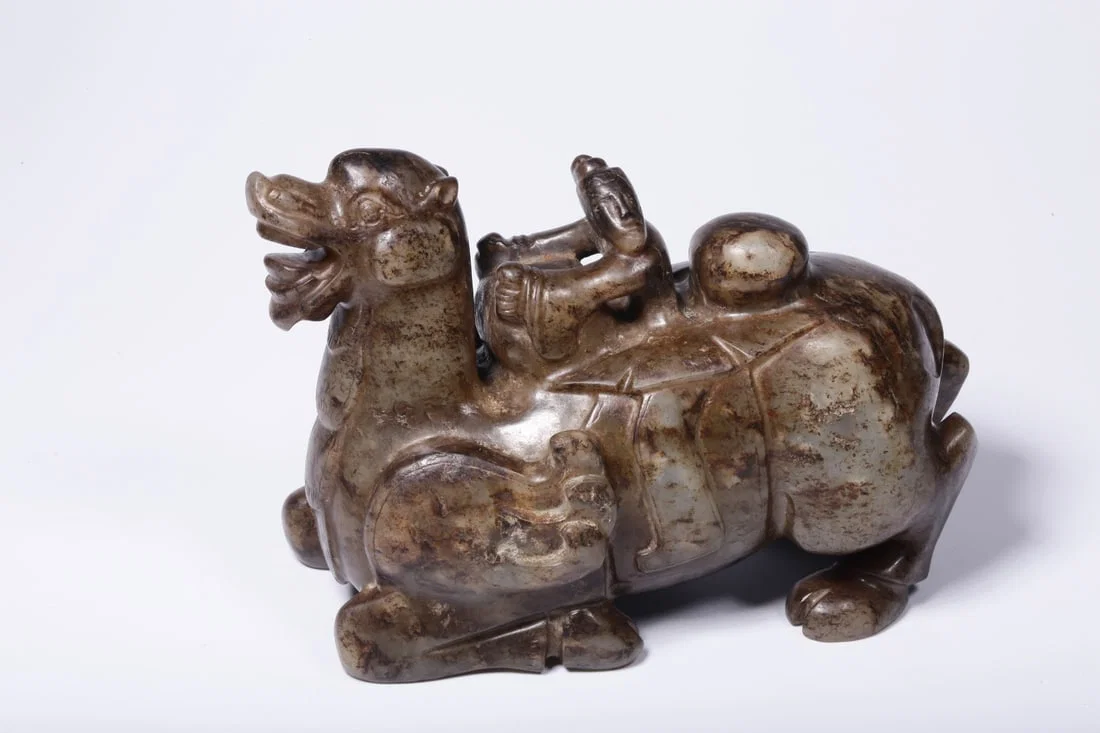 A Jade Figure and Beast Carving
