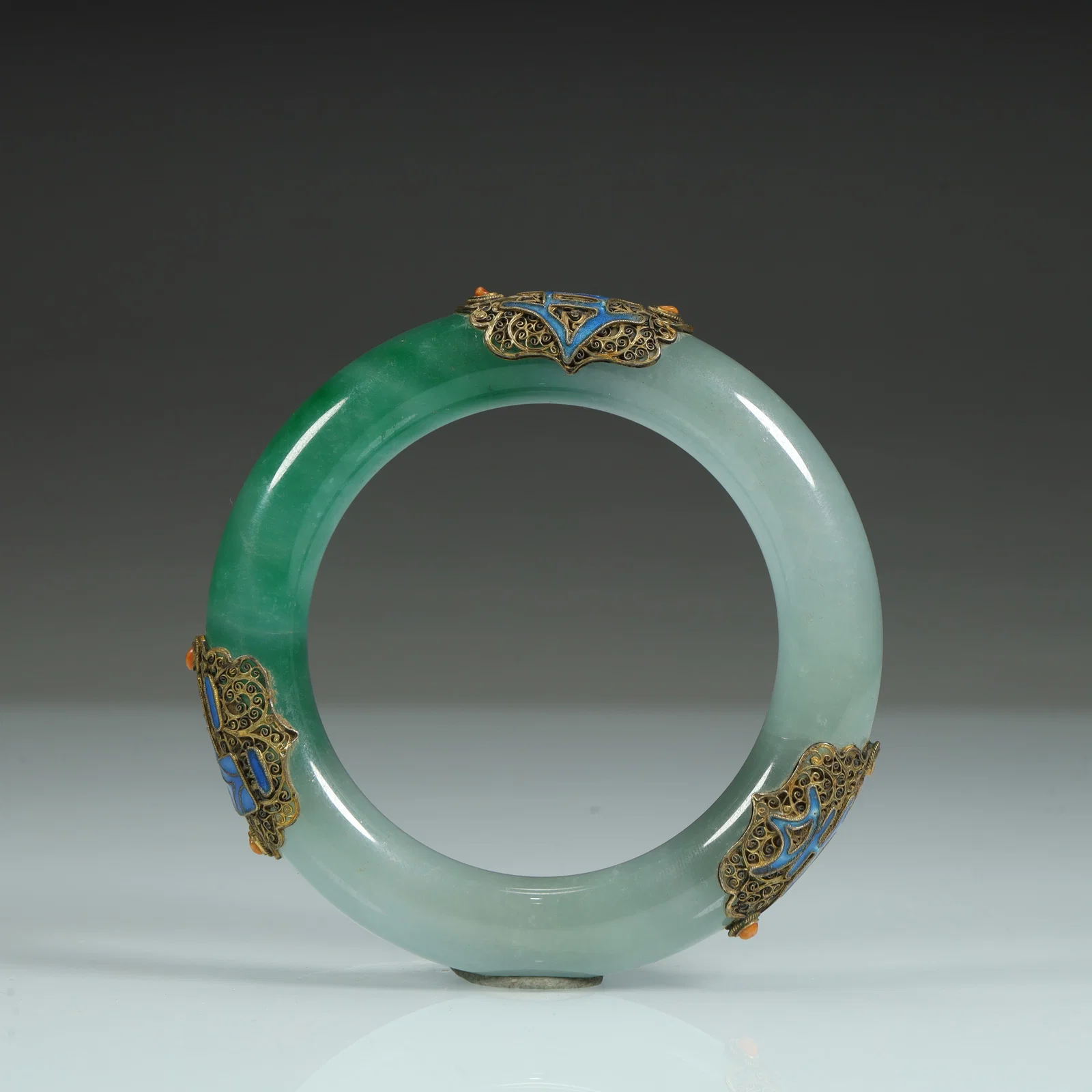A jadeite inlaid gold silk burnt blue bracelet of the Qing Dynasty