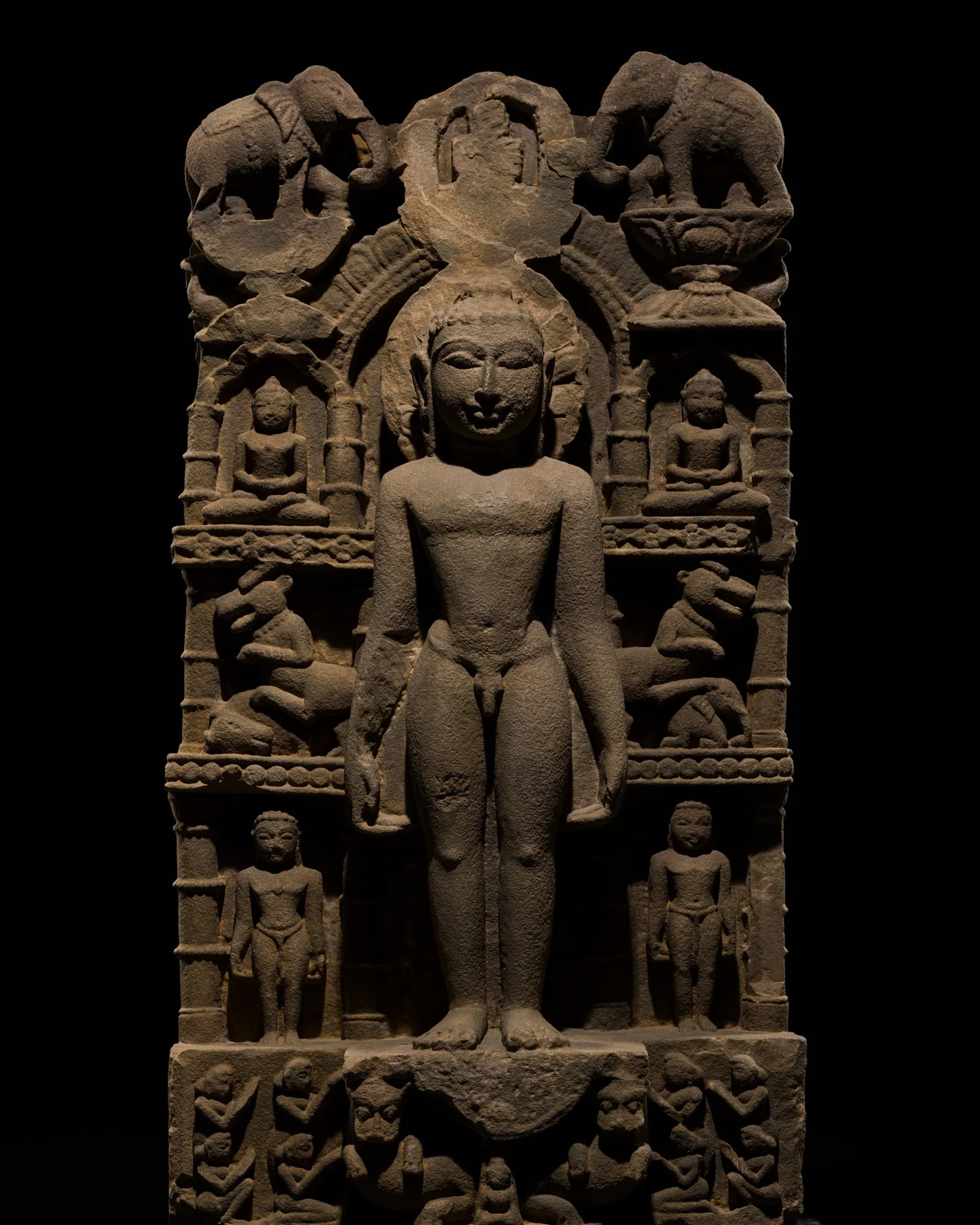 A JAIN SANDSTONE STELE OF MAHAVIRA, MADHYA PRADESH OR RAJASTHAN, 10TH-11TH CENTURY