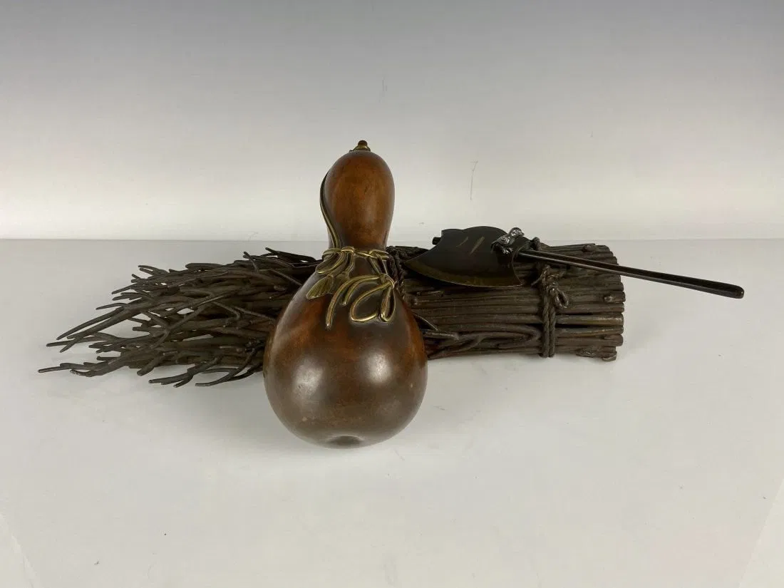 A JAPANESE MIXED METAL SCULPTURE