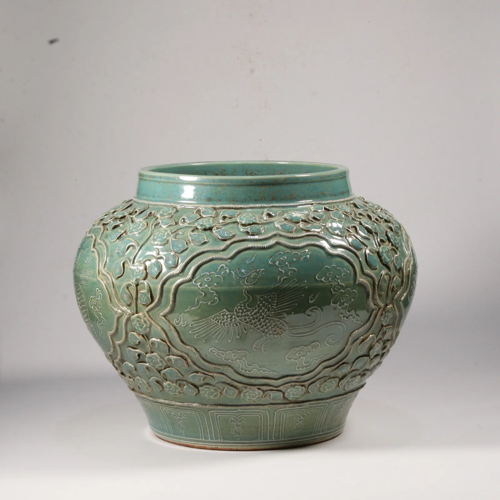 A JUN KILN JAR WITH PHOENIX AND QILIN MOTIFS