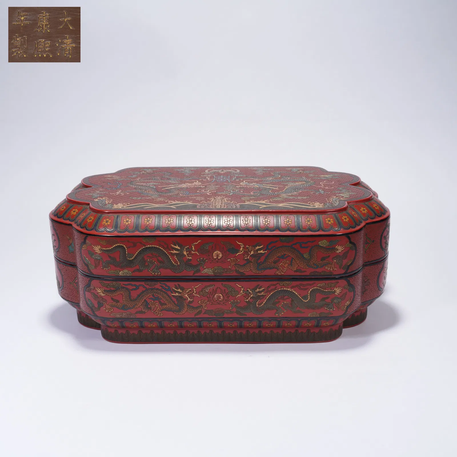 A LACQUER BOX WITH ENGRAVED GILT TWIN DRAGONS AND SHOU MEDALLION