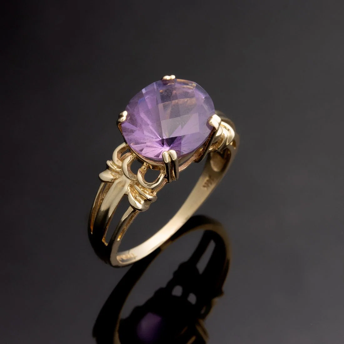 A LADY'S 14K MOUNTING WITH OVAL FANTASY CUT AMETHYST