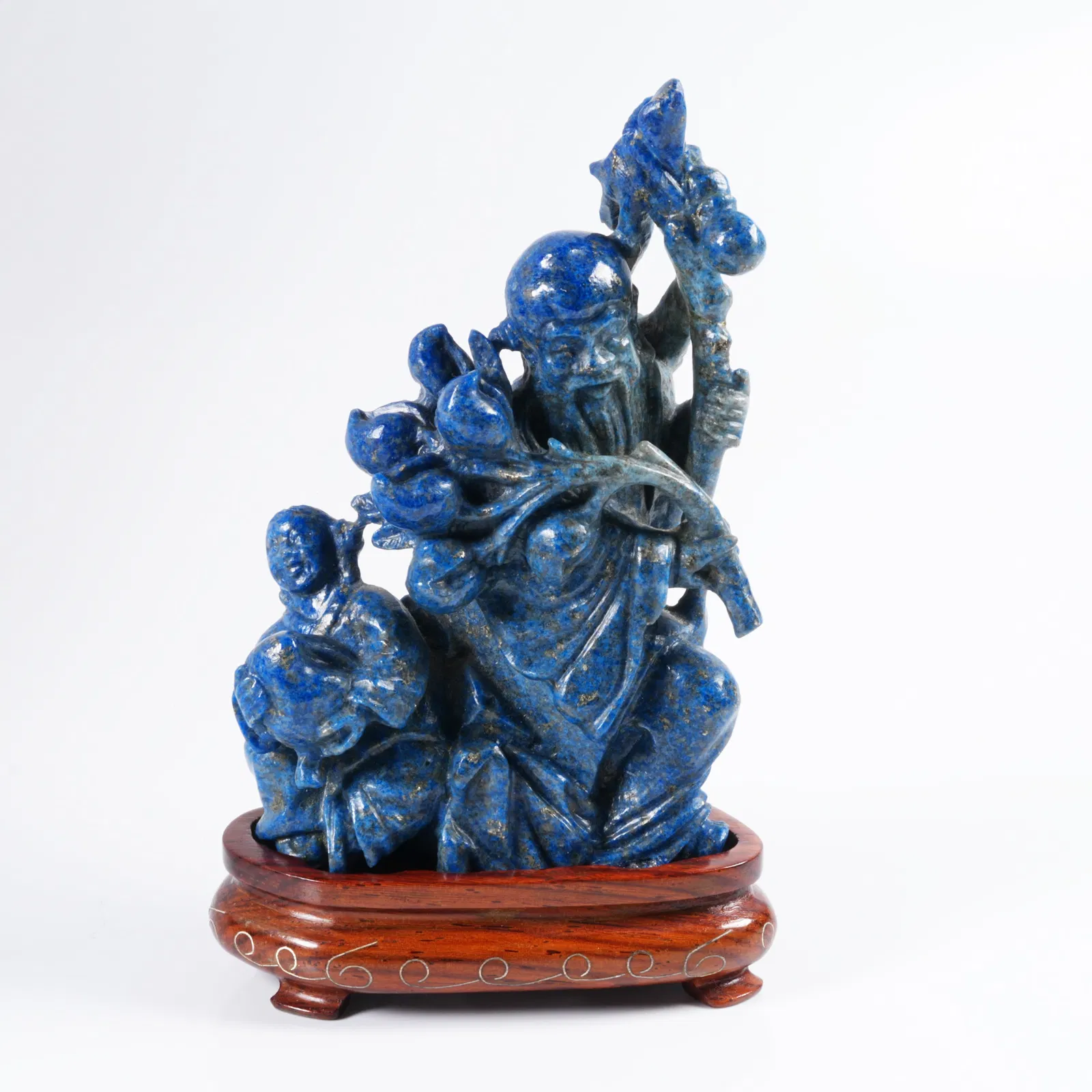 A LAPIS LAZULI SHOUXING (GOD OF LONGEVITY) STATUE
