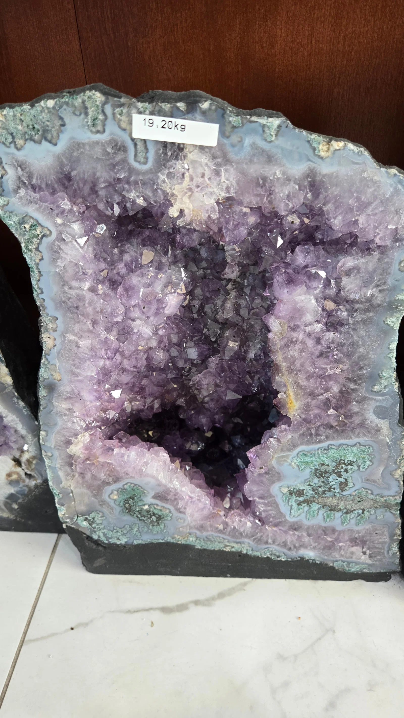 A LARGE AMETHYST GEODE POLISHED EDGES