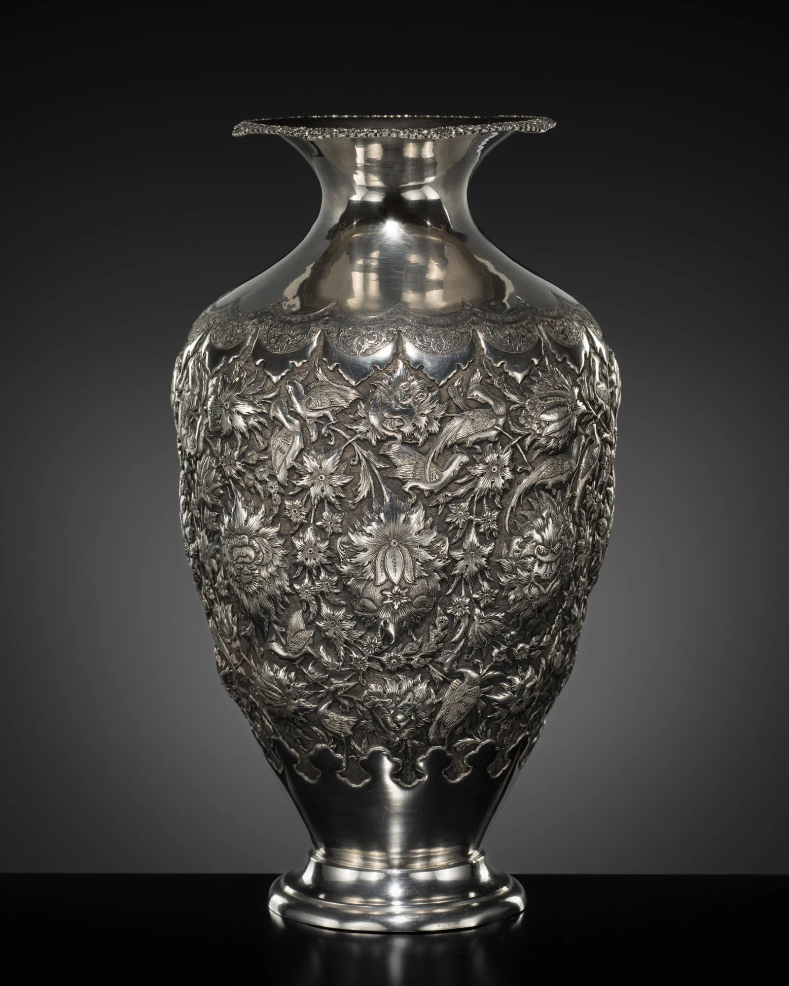 A LARGE AND FINELY ENGRAVED SILVER 'BIRDS AND FLOWERS' VASE, IRAN, FIRST HALF OF THE 20TH CENTURY