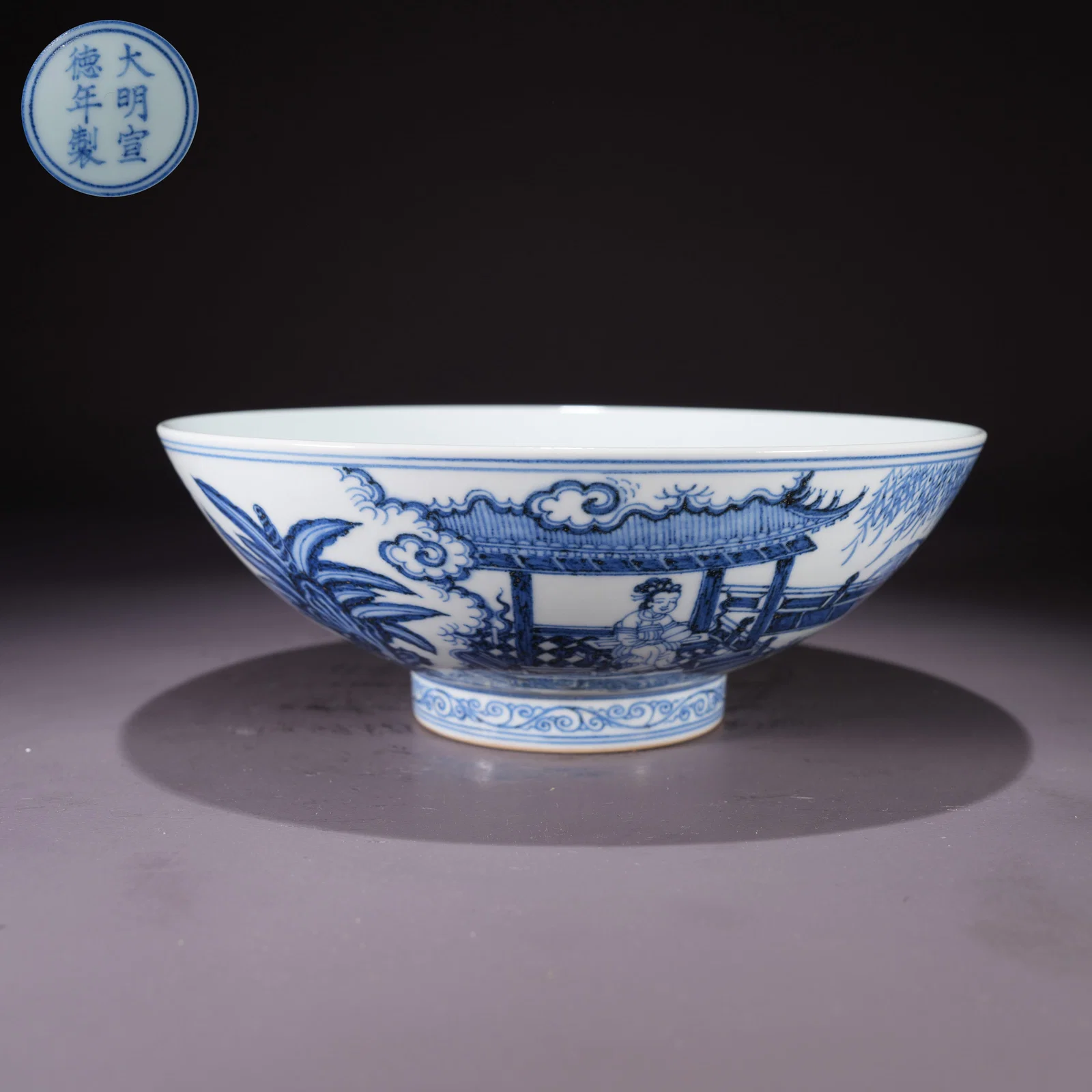 A LARGE BLUE-AND-WHITE BOWL WITH CHILDREN AT PLAY IN GARDEN SCENE