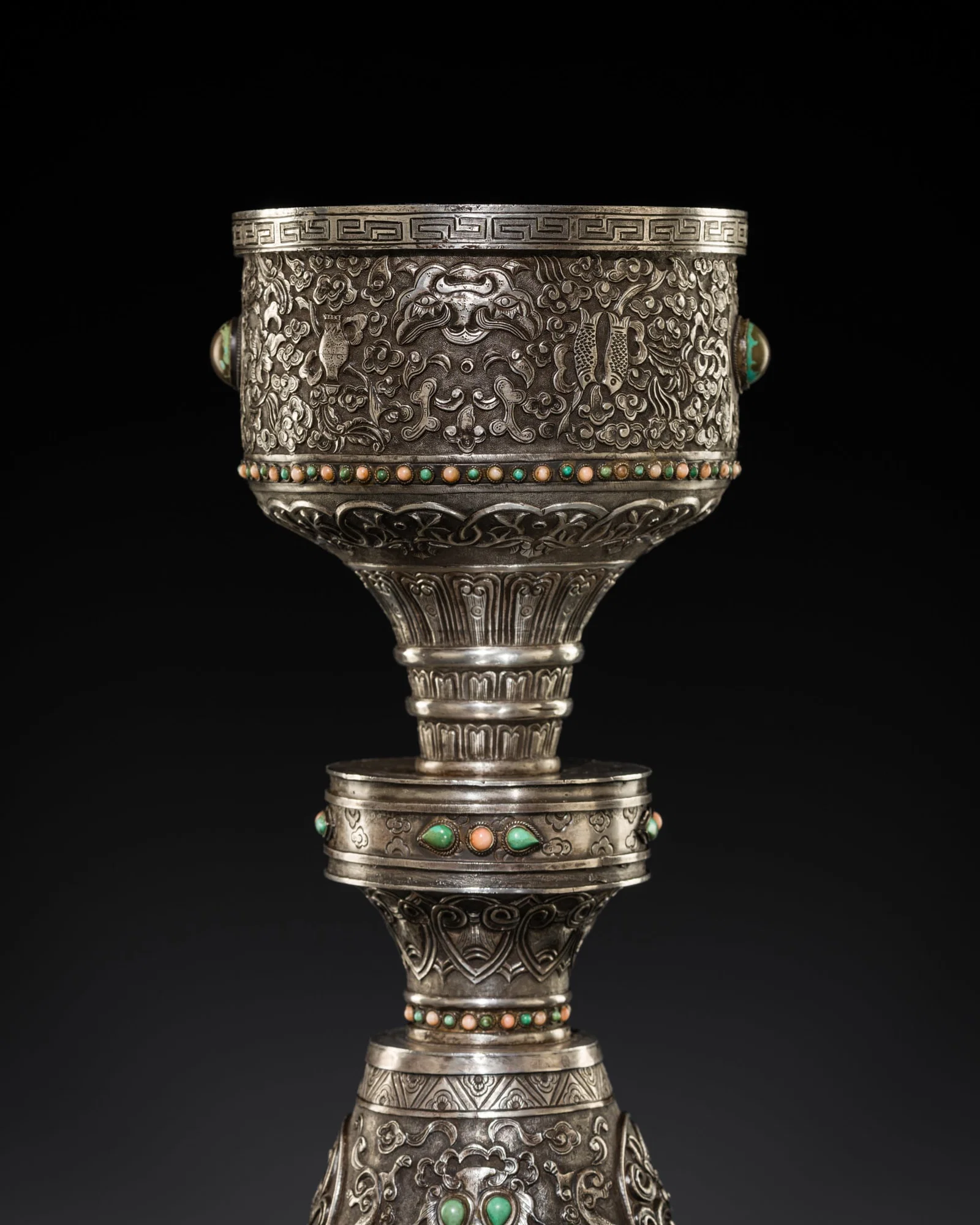 A LARGE CORAL AND TURQUOISE-INLAID SILVER REPOUSSÉ 'ASHTAMANGALA' BUTTER LAMP, CHO-KUNG,