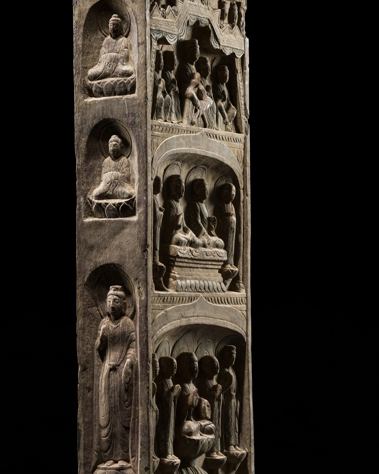 A LARGE FOUR-SIDED, INSCRIBED, AND PAINTED LIMESTONE STELE WITH MAITREYA AND SHAKYAMUNI, NORTHERN QI