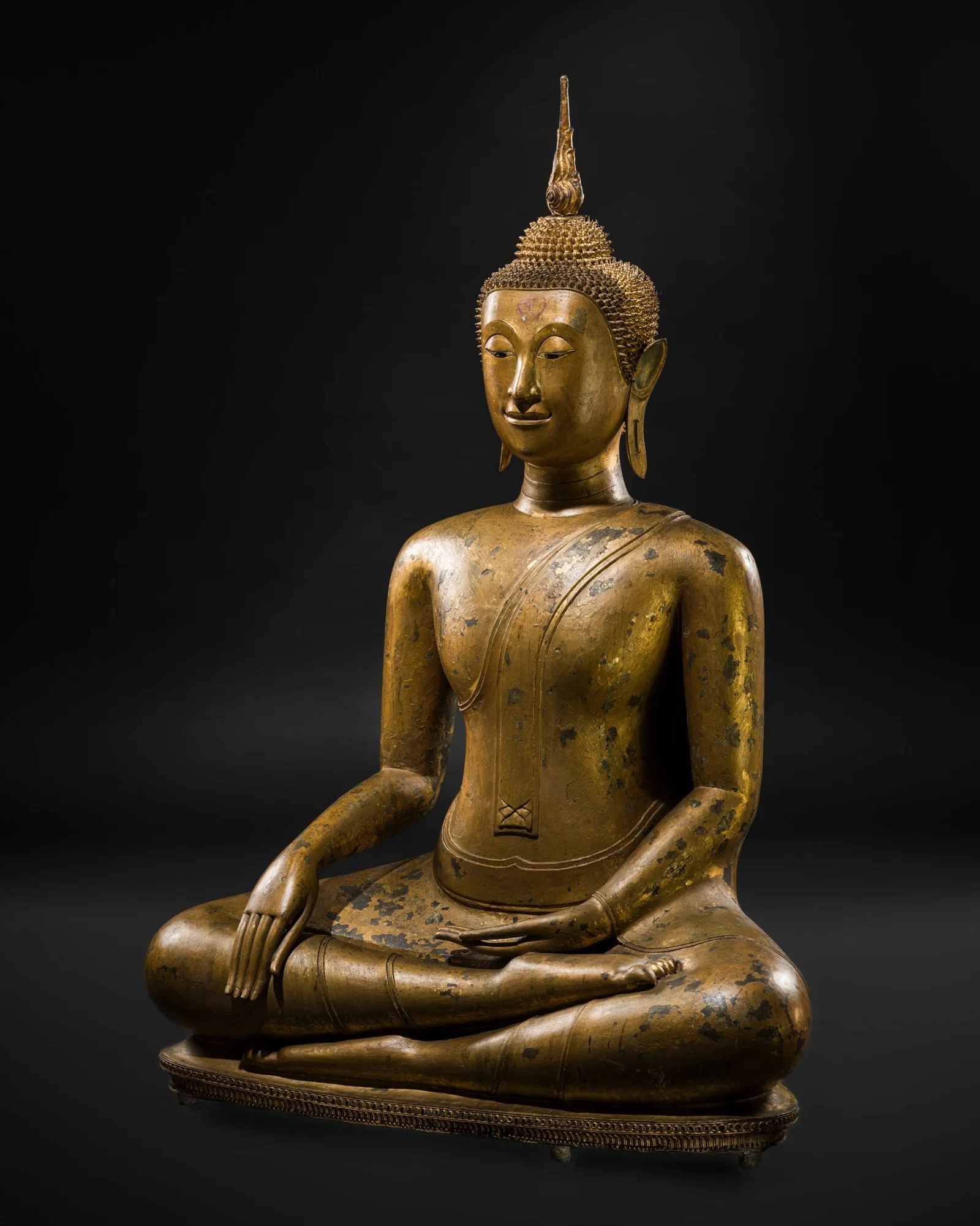 A LARGE GILT-LACQUERED BRONZE FIGURE OF BUDDHA MARAVIJAYA, LATE AYUTTHAYA PERIOD, 18TH TO EARLY 19TH