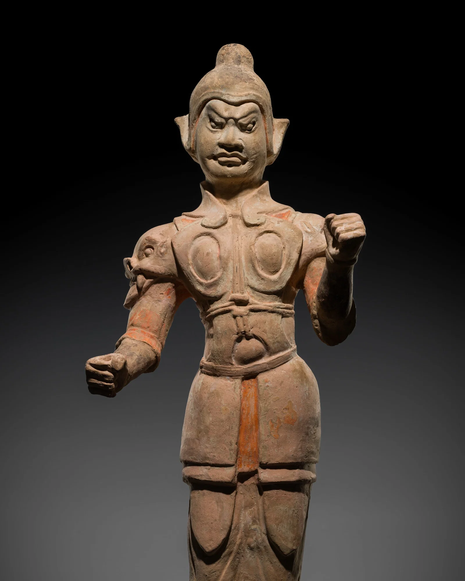A LARGE PAINTED POTTERY FIGURE OF A WARRIOR, TANG DYNASTY
