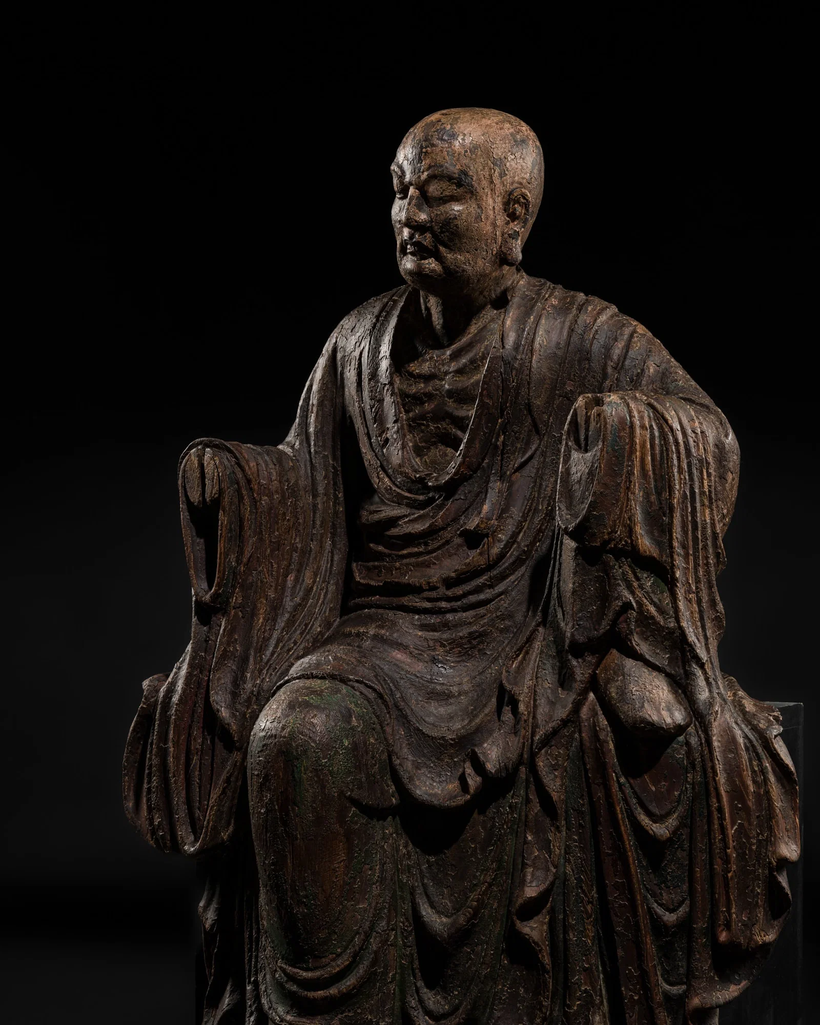 A LARGE POLYCHROME WOOD FIGURE OF BODHIDHARMA AFTER HIS RESURRECTION, EARLY MING DYNASTY