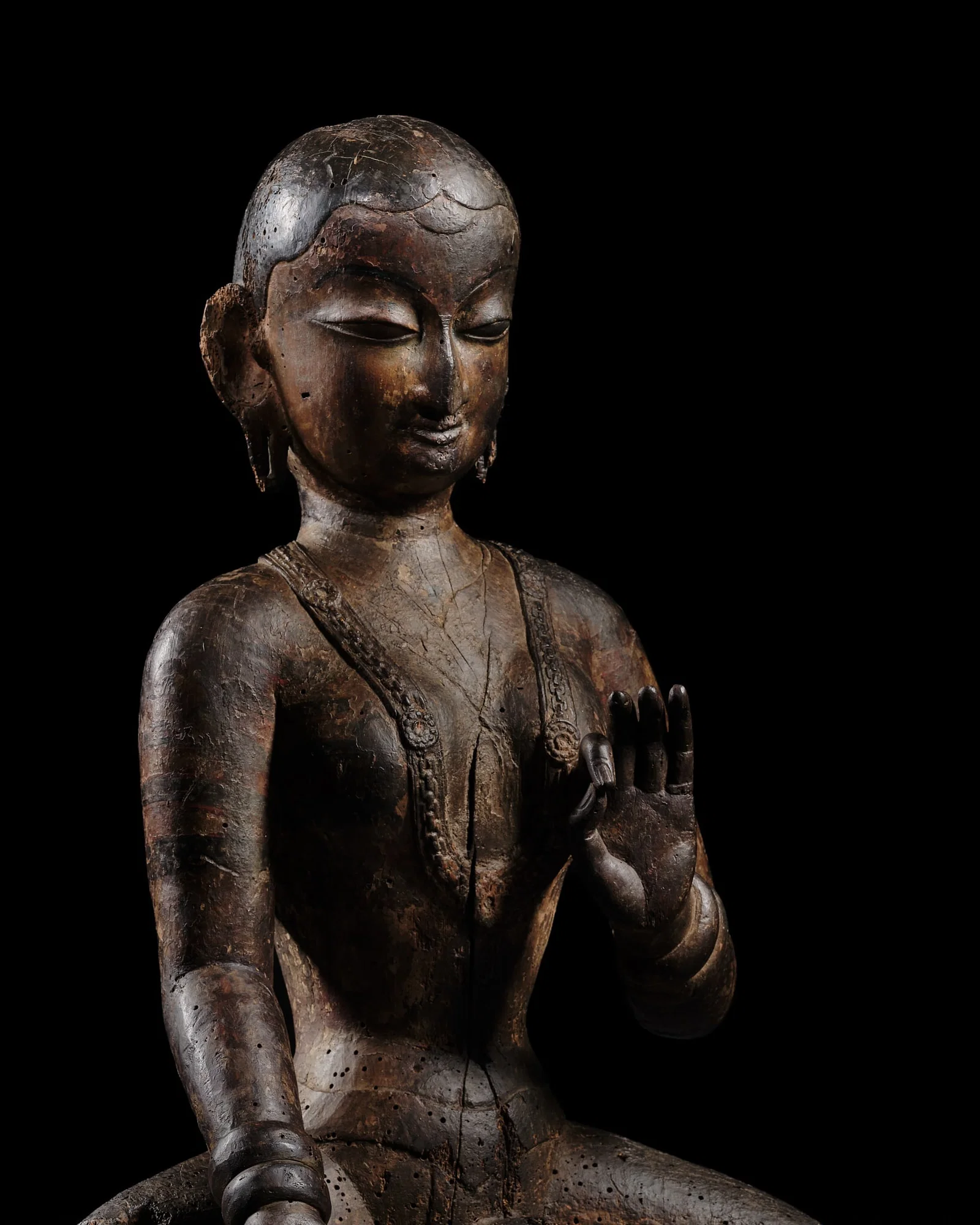 A LARGE POLYCHROME WOOD FIGURE OF TARA, NEPAL, CIRCA 16TH CENTURY