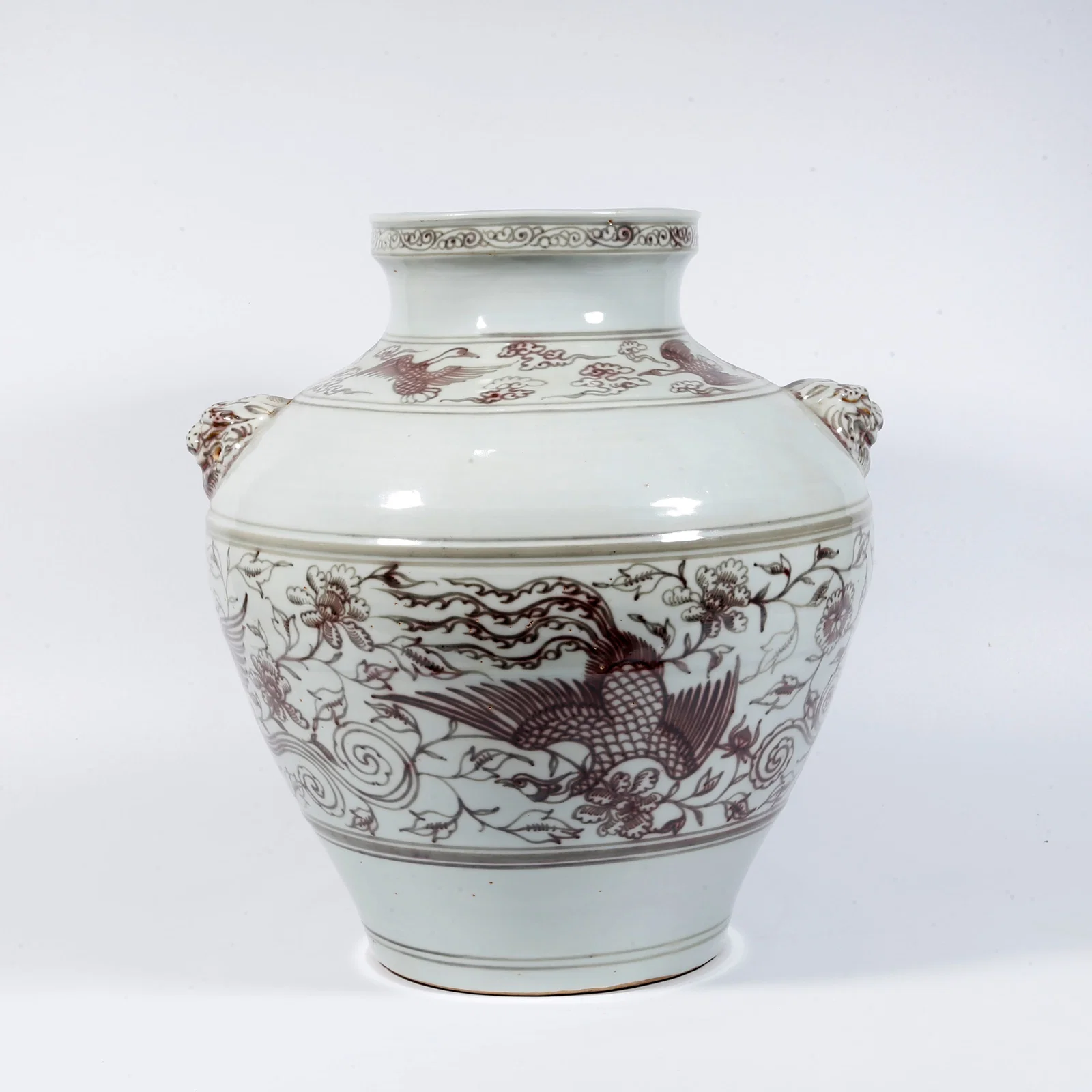 A LARGE UNDERGLAZE RED JAR WITH DOUBLE BEAST HANDLES