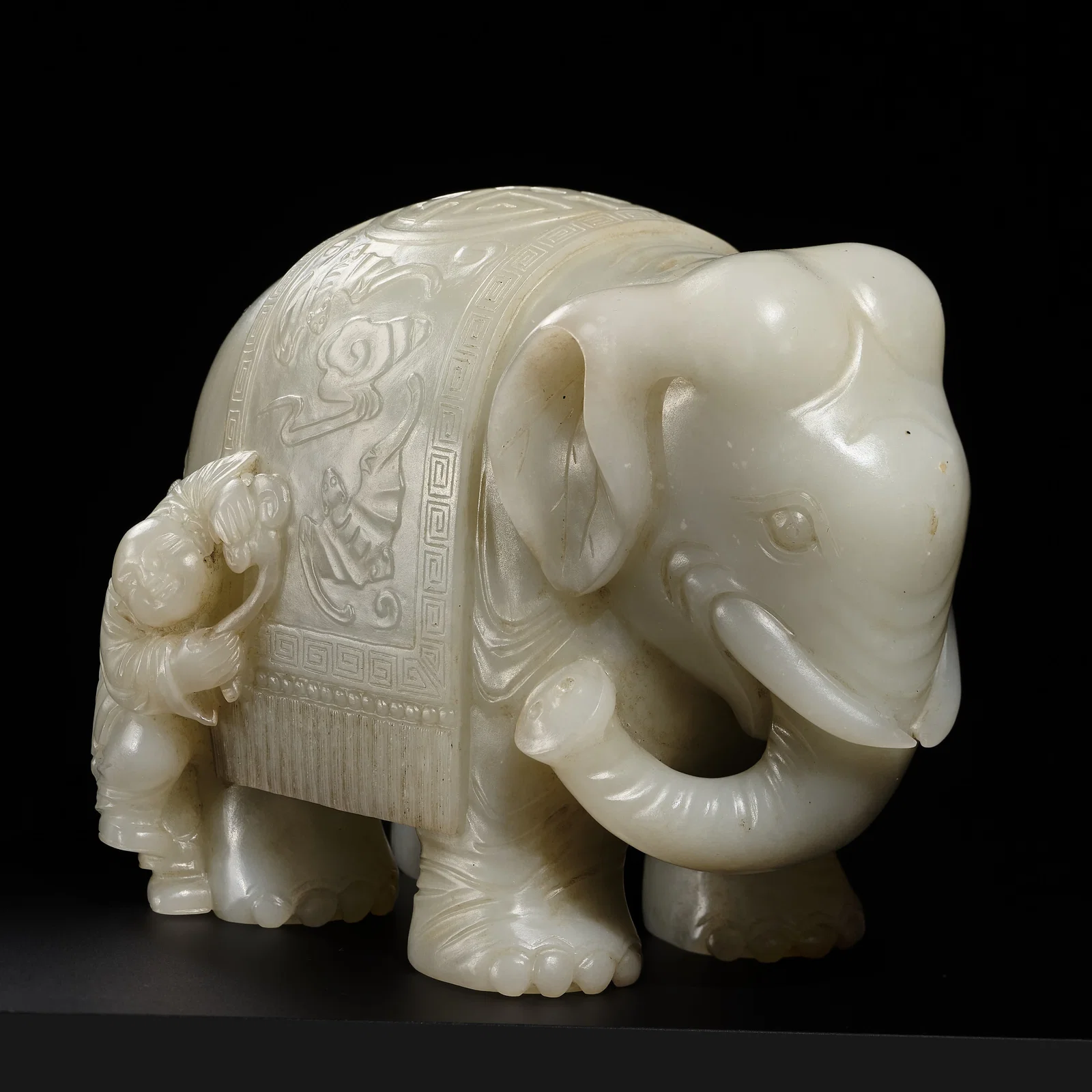 A LARGE WHITE JADE FIGURE OF AN ELEPHANT AND A BOY, 18TH CENTURY