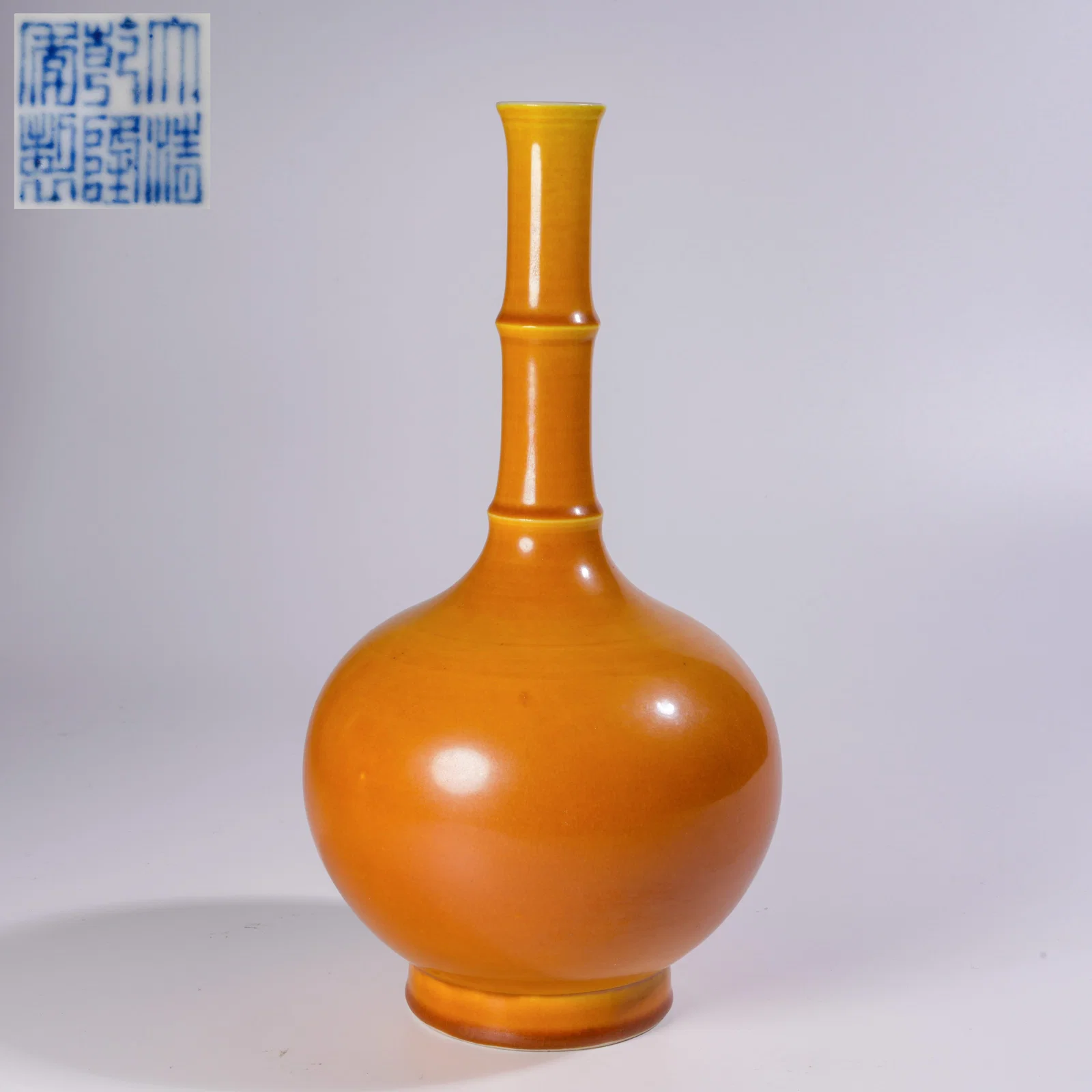 A LEMON-YELLOW GLAZED LONG-NECKED VASE WITH STRING BANDS