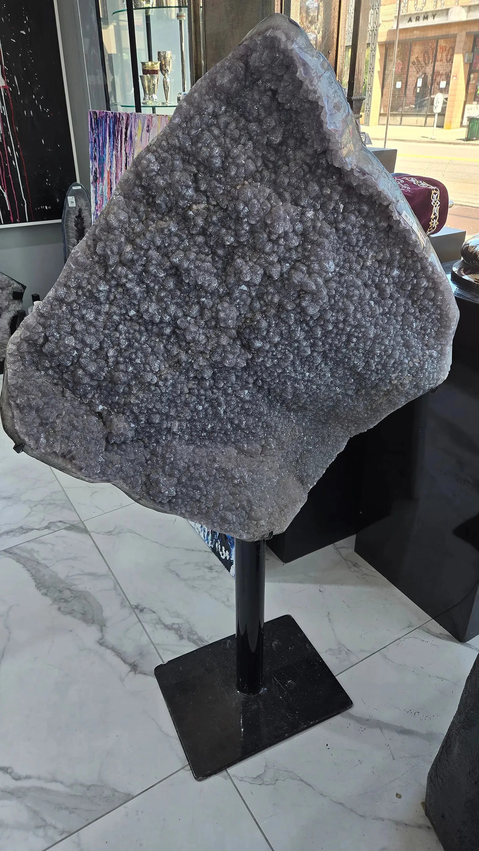 A MAGNIFICENT AMETHYST PLATE ON A PROFESSIONAL STAND