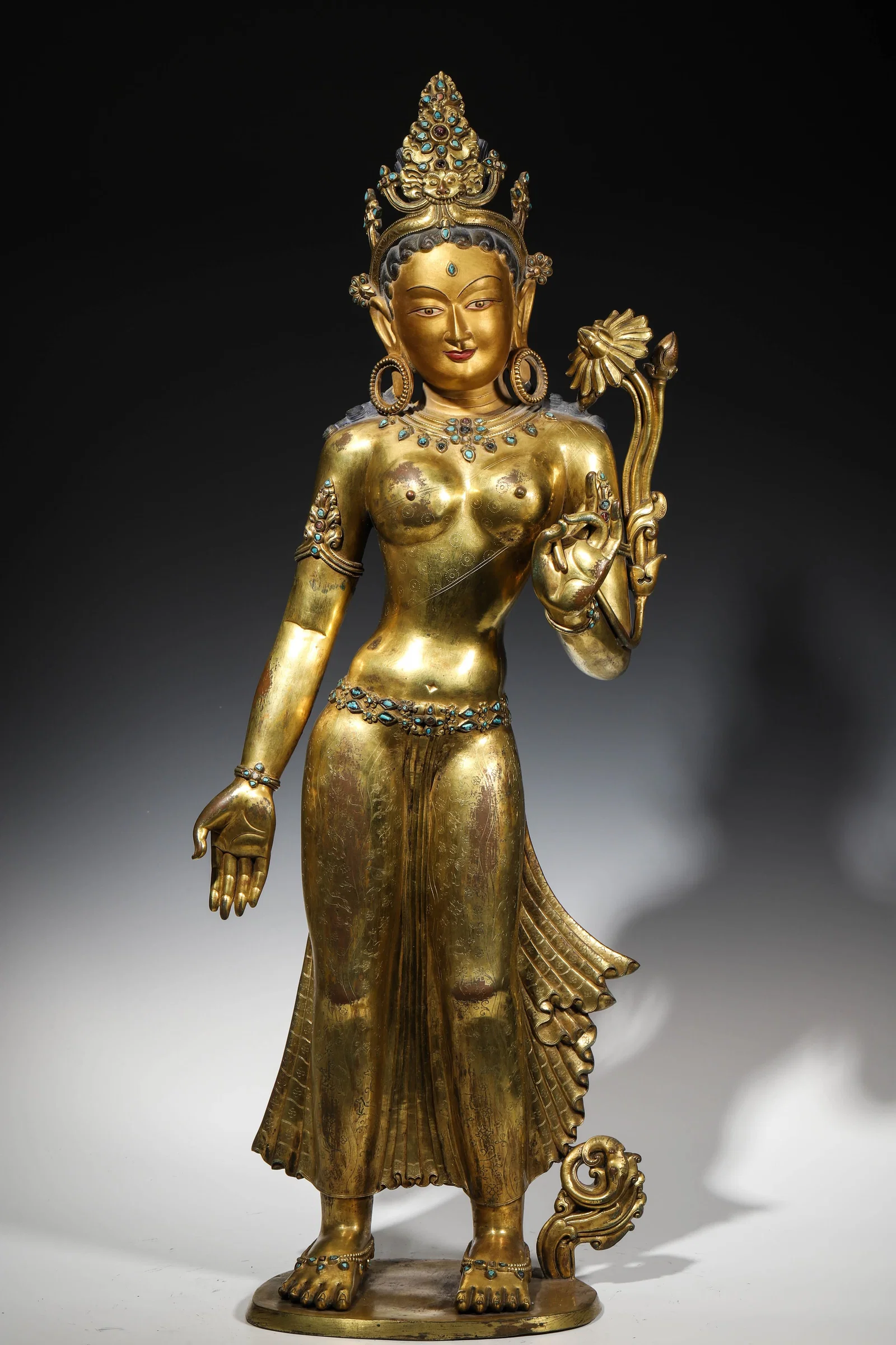 A MAGNIFICENT GILT-BRONZE INLAID GEM STANDING PADMAPANI LOKESHVARA, MALLA DYNASTY, 13TH-14TH