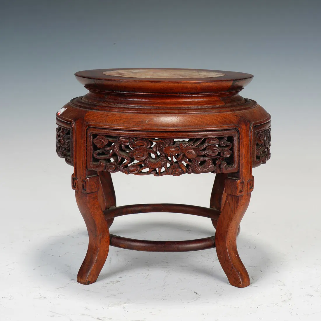 A MARBLE INLAID ANNATTO-WOOD GARDEN STOOL