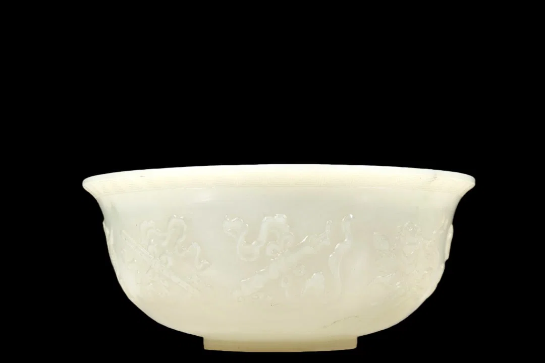 A Marvelous White Jade 'Weapons Of The Eight Immortals' Bowl