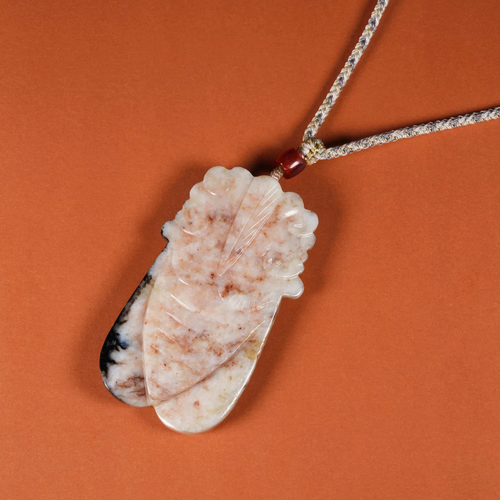 A MEDIEVAL JADE CICADA PENDANT