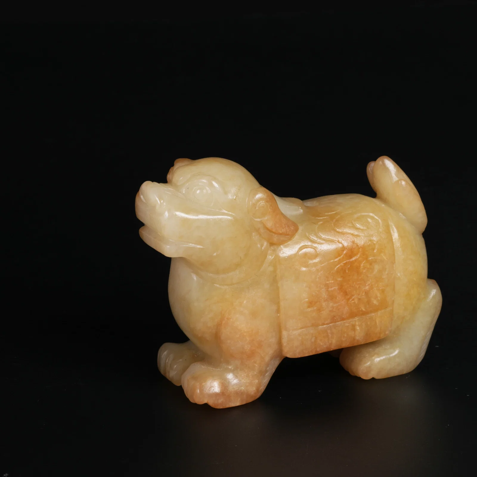 A MEDIEVAL JADE PENDANT WITH AUSPICIOUS BEAST MOTIF