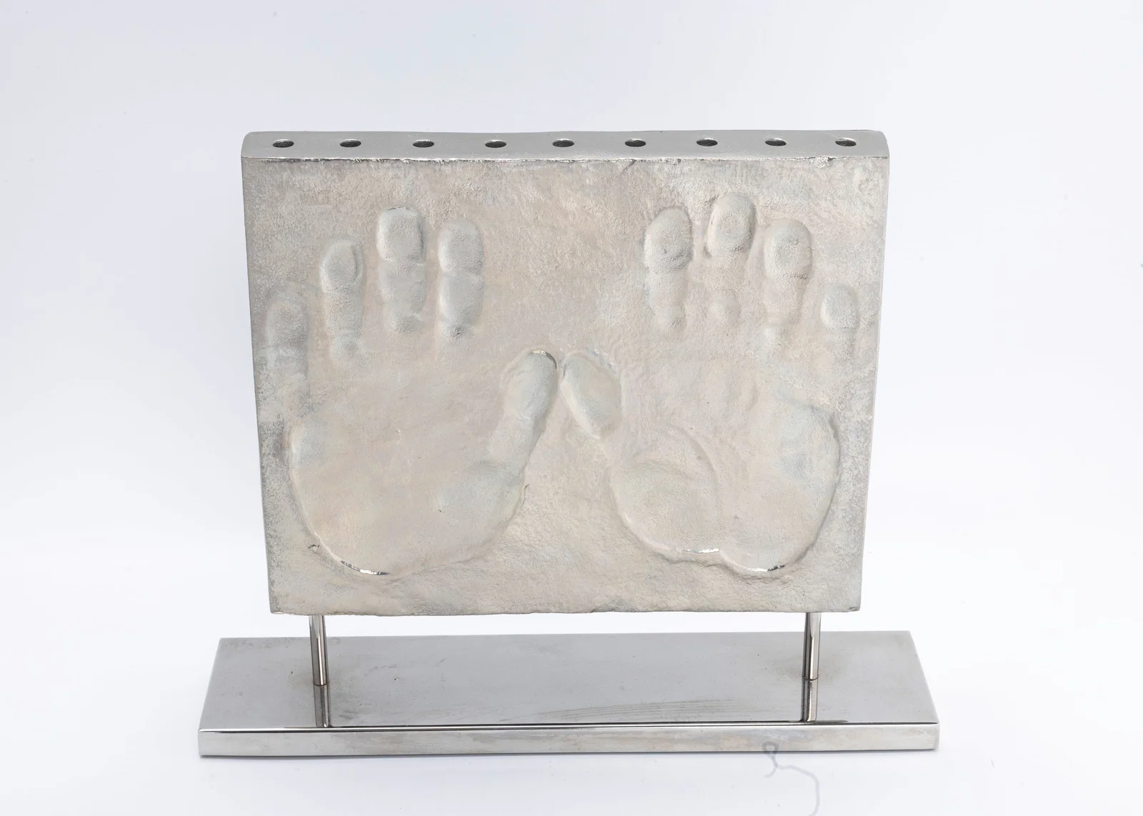 A MODERN CHROME HANUKKAH MENORAH BY MICHAEL ARAM