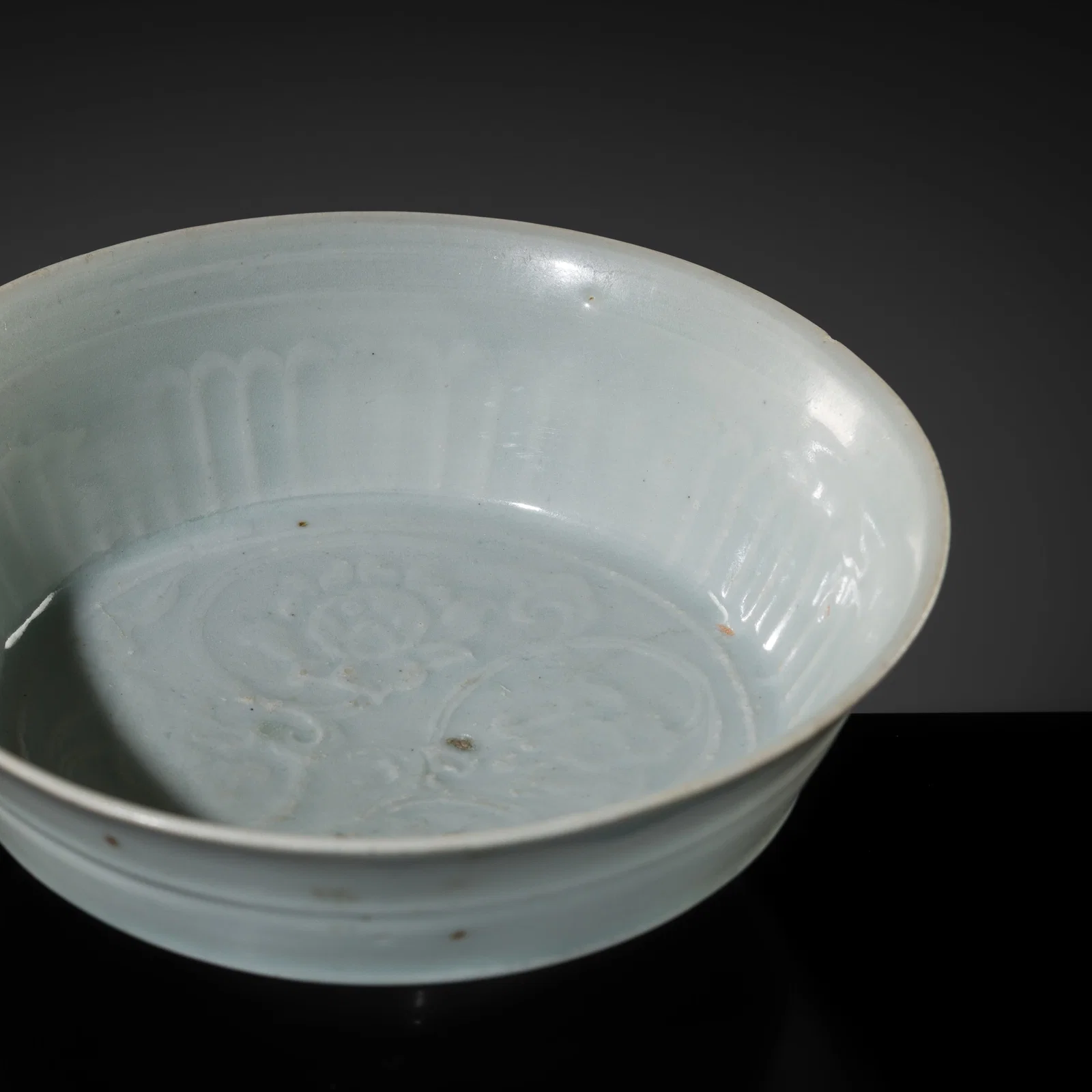 A MOLDED SHUFU-TYPE WHITE GLAZED BOWL, YUAN DYNASTY