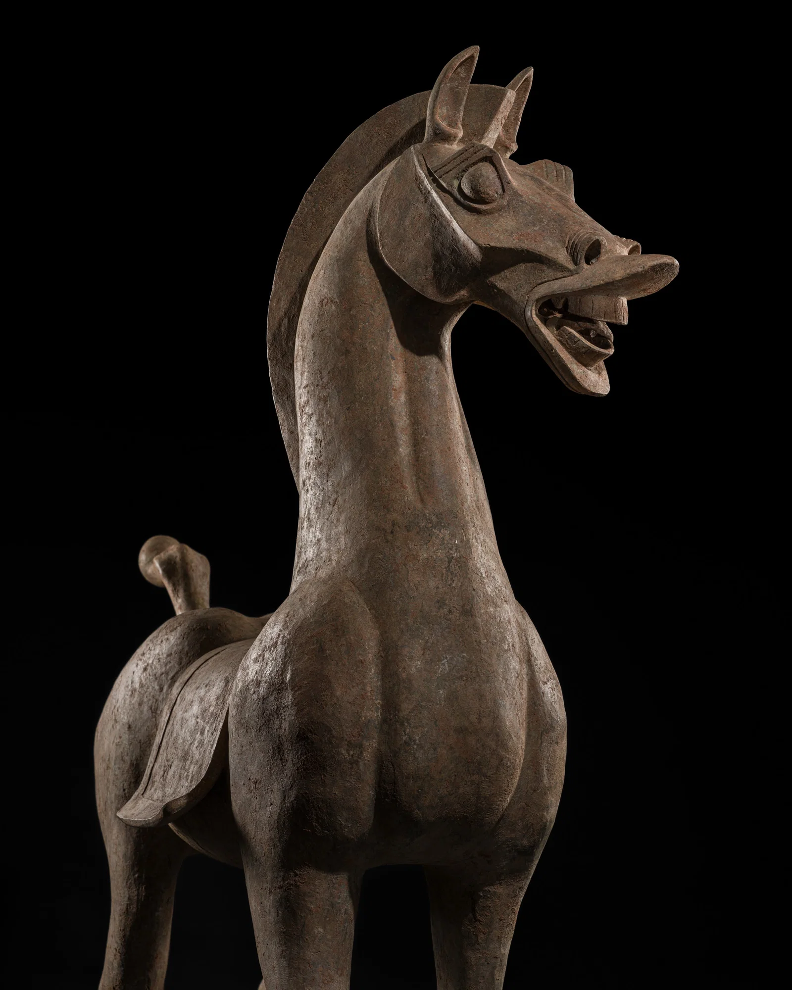 A MONUMENTAL AND HIGHLY IMPORTANT SICHUAN POTTERY HORSE, HAN DYNASTY, THE LARGEST EVER RECORDED FROM