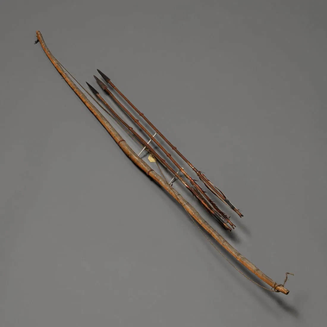 A Northern Plains bow with three arrows from Fenn Collection