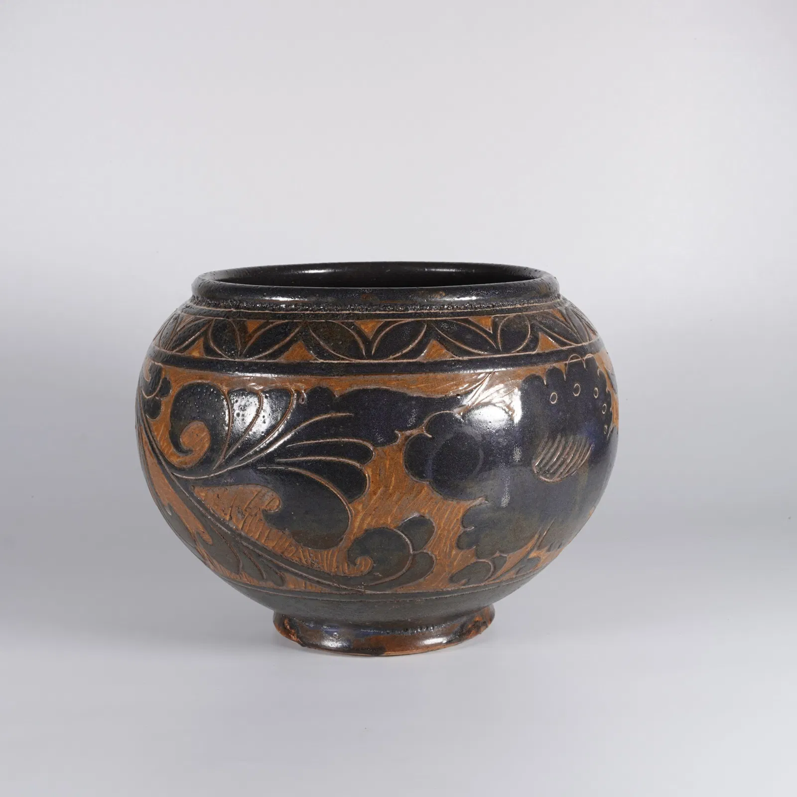 A OLD KILN CARVED JAR