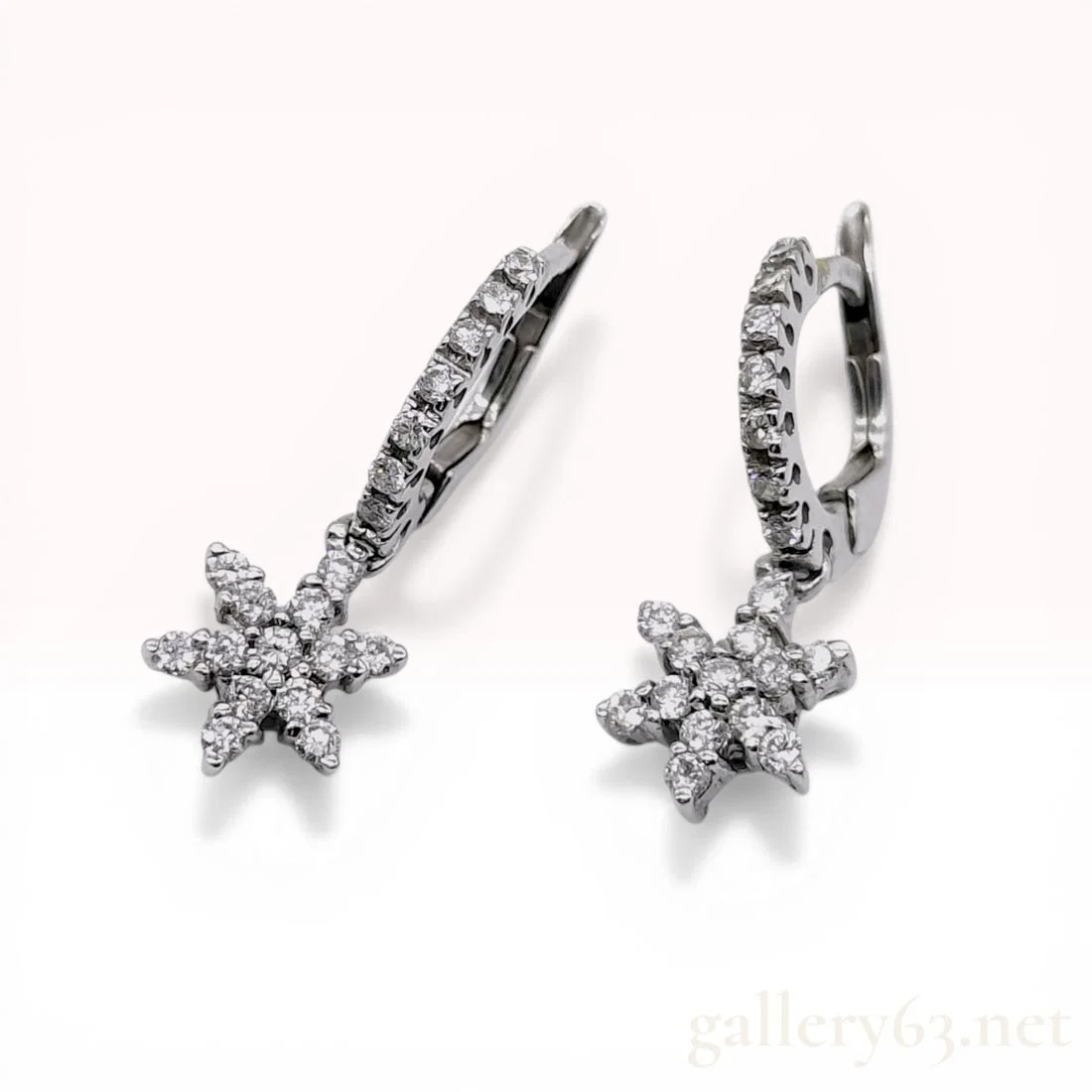 A Pair of 18K White Gold and Diamond Snowflake Huggie Drop Earrings