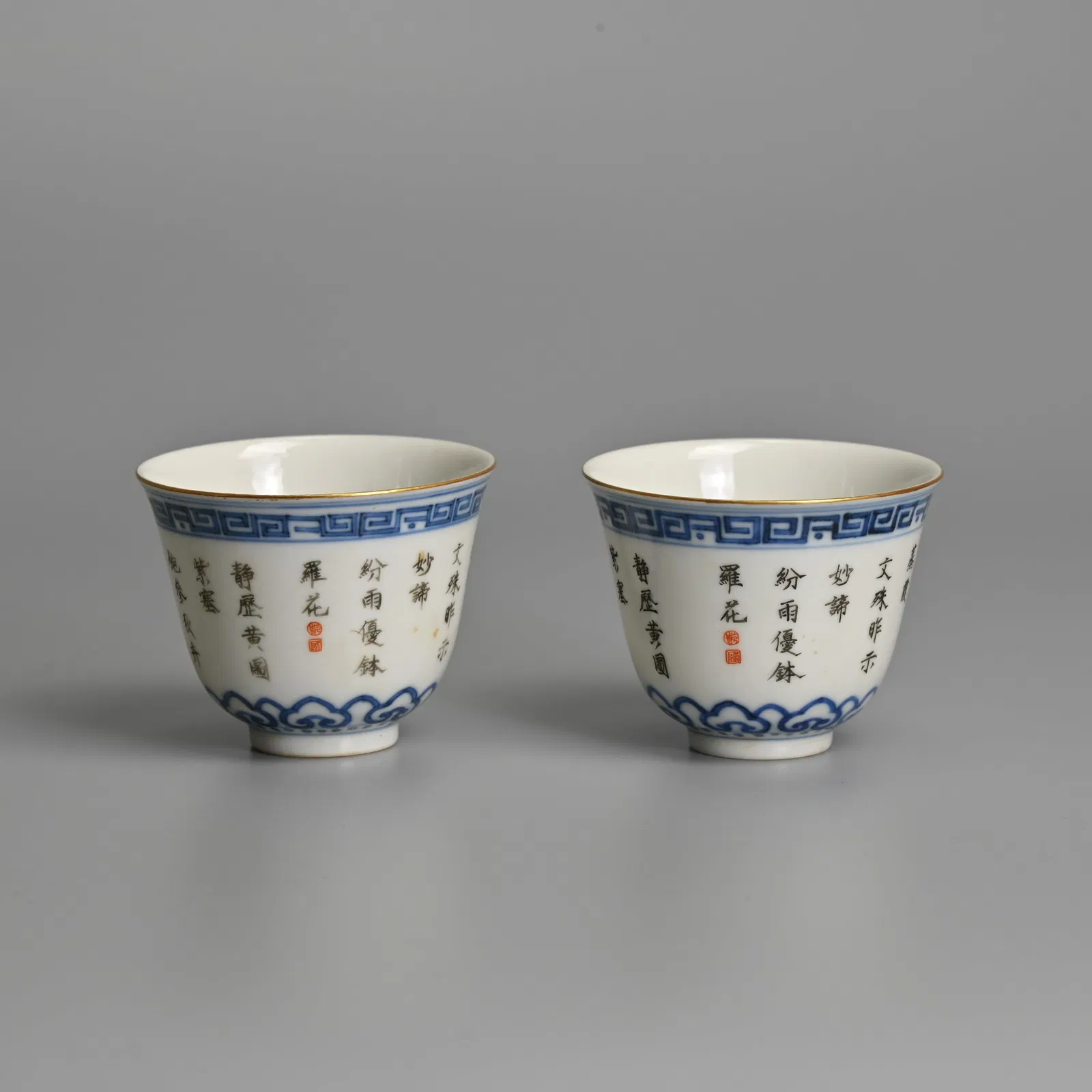 A PAIR OF CHINESE UNDERGLAZE BLUE AND INSCRIBED PORCELAIN WINE CUPS, 'TUI SI TANG ZHI', LATE QING /
