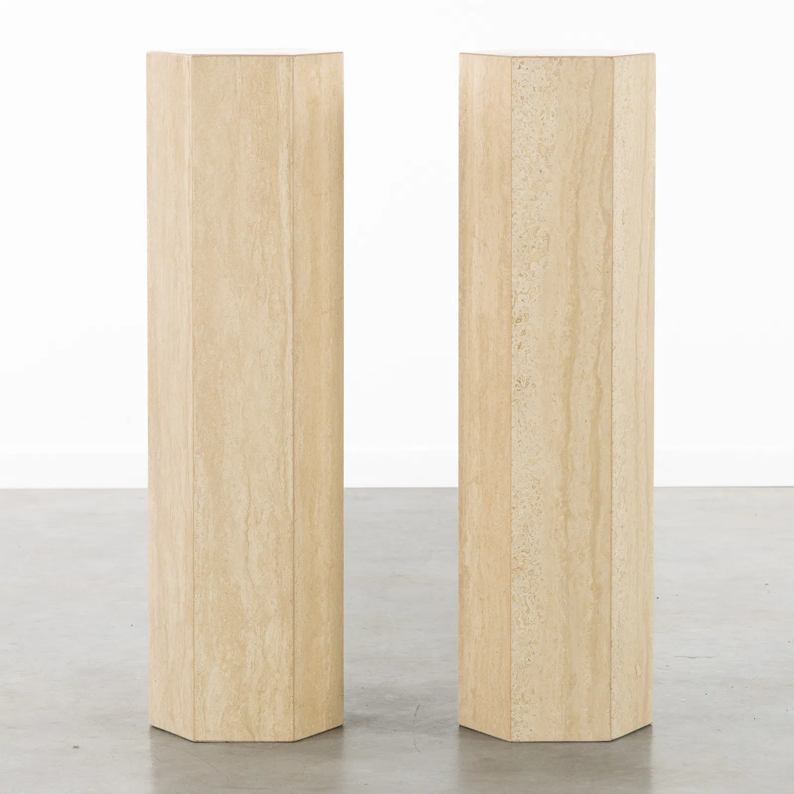 A Pair of decorative hexagonal Consoles or Pedestals, travertine.