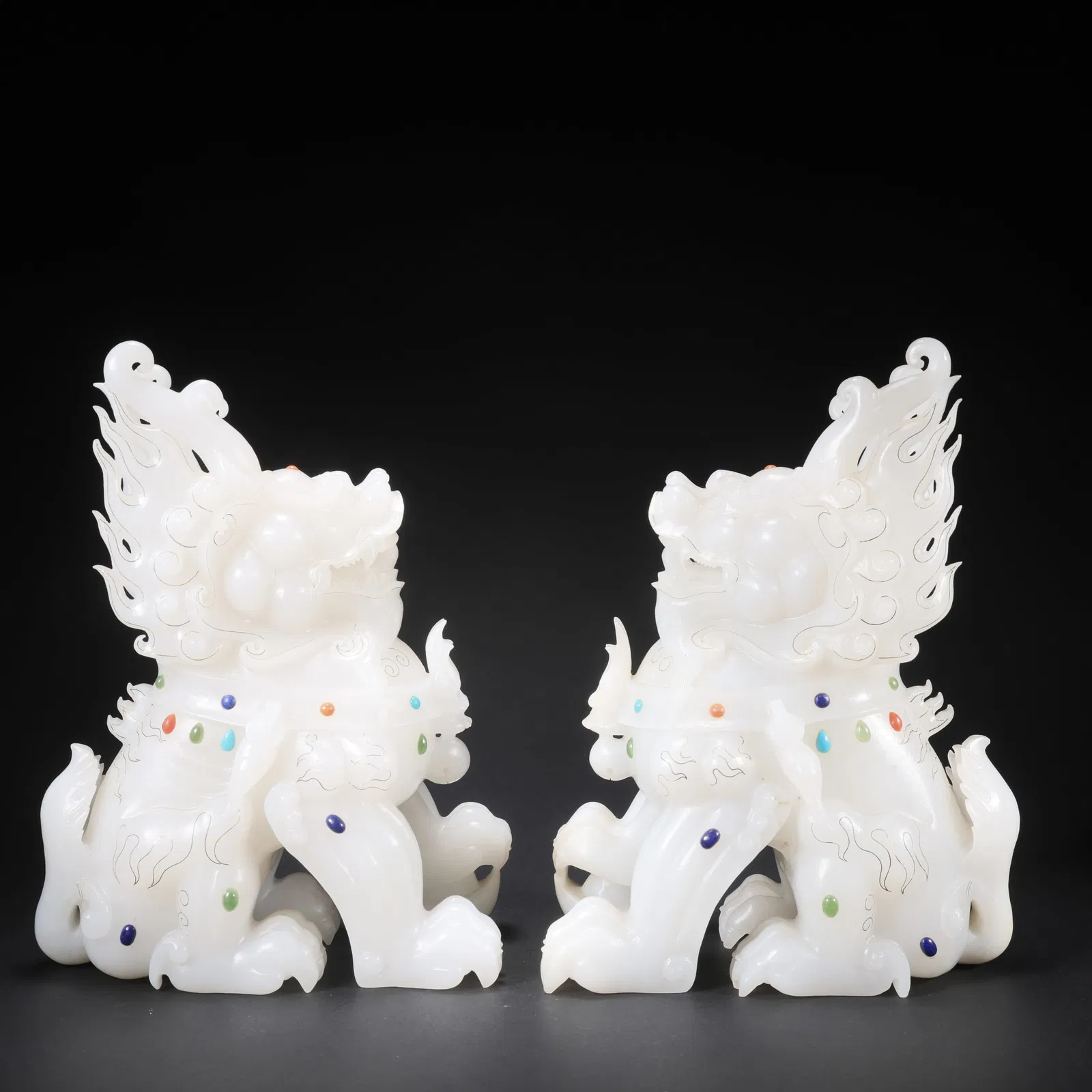 A PAIR OF HETIAN JADE QILIN INLAID WITH GOLD, SILVER, AND GEMSTONES