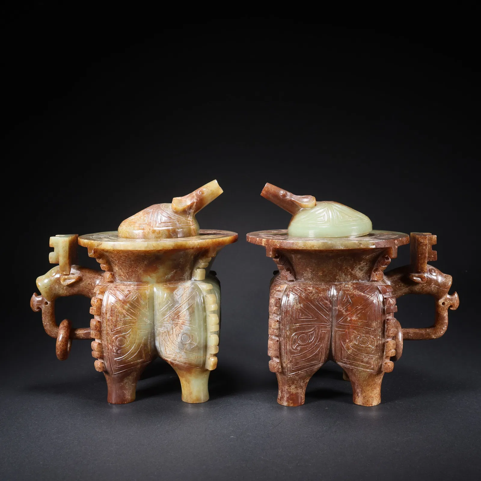 A PAIR OF HETIAN JADE WINE VESSELS WITH DRAGON-HEAD MOVABLE RINGS