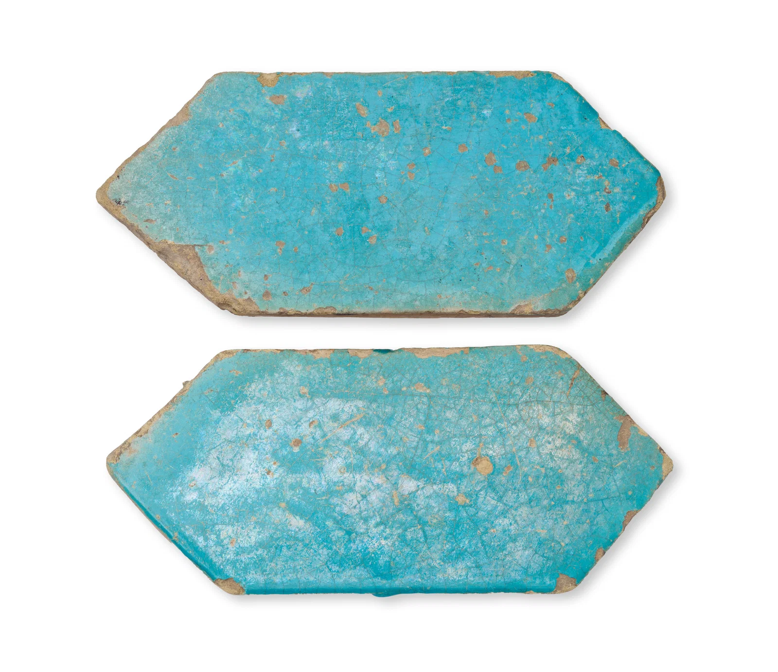 A PAIR OF KASAHN TURQUOISE GLAZED ELONGATED HEXAGONAL TILES, PERSIA, 12TH - 13TH CENTURY